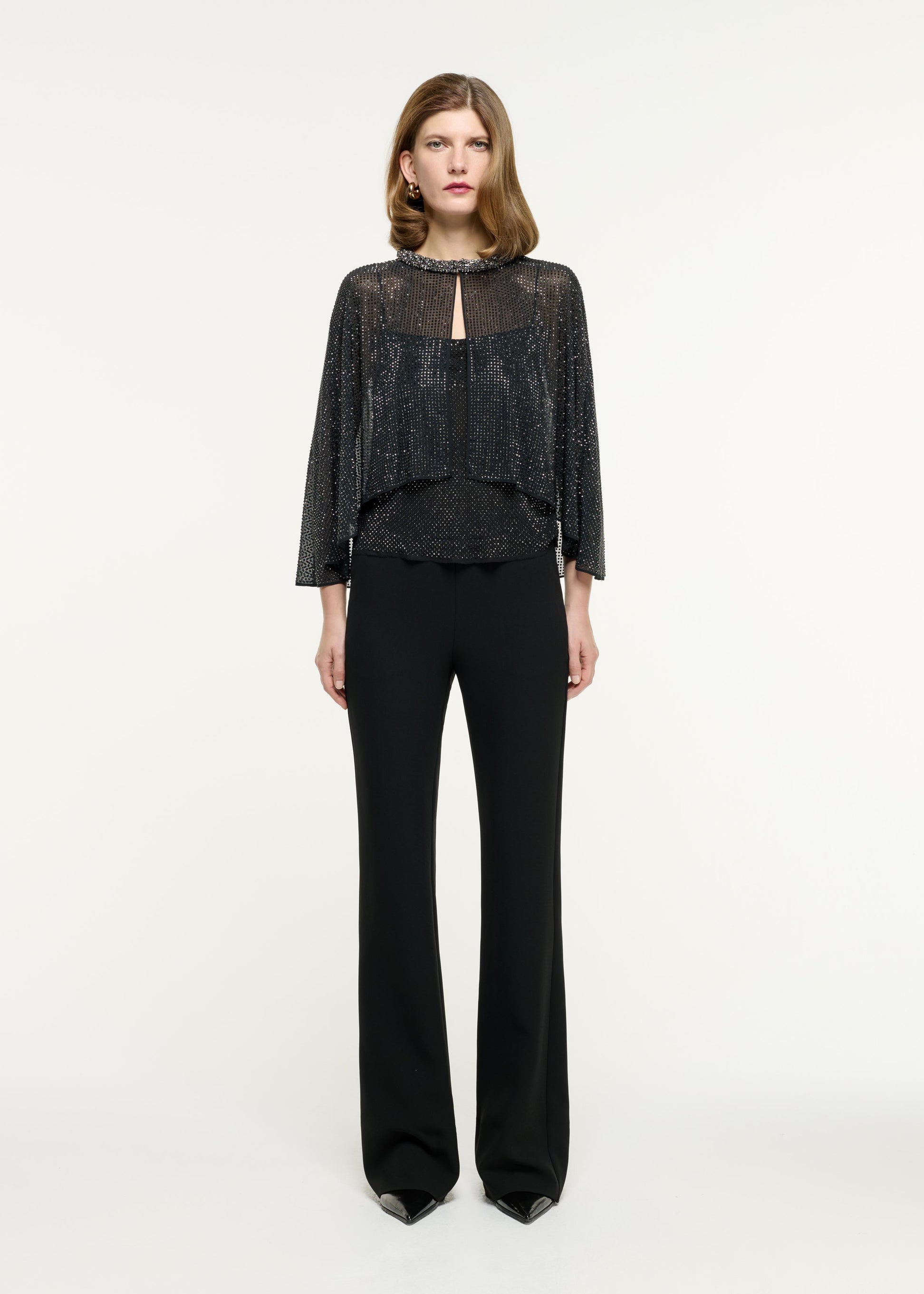 Front view of a model wearing the Flared Heavy Cady Trouser in Black