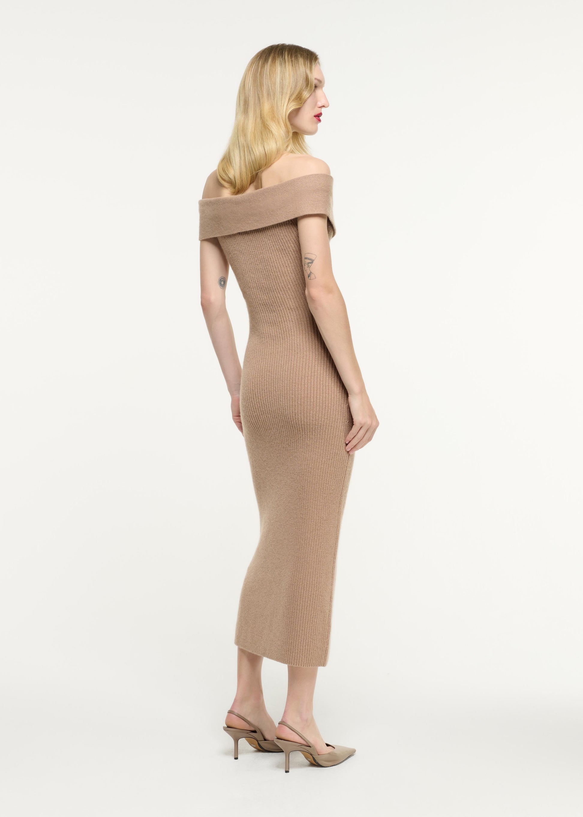 Back view of a model wearing the Off Shoulder Cashmere Midi Dress in Beige