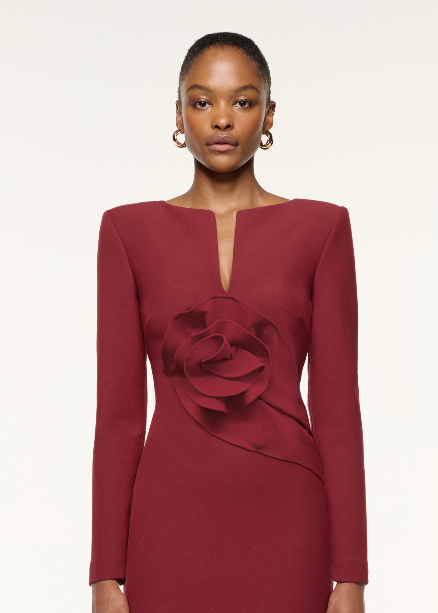 Close up of a model wearing the Flower Detail Evening Gown in Mulberry