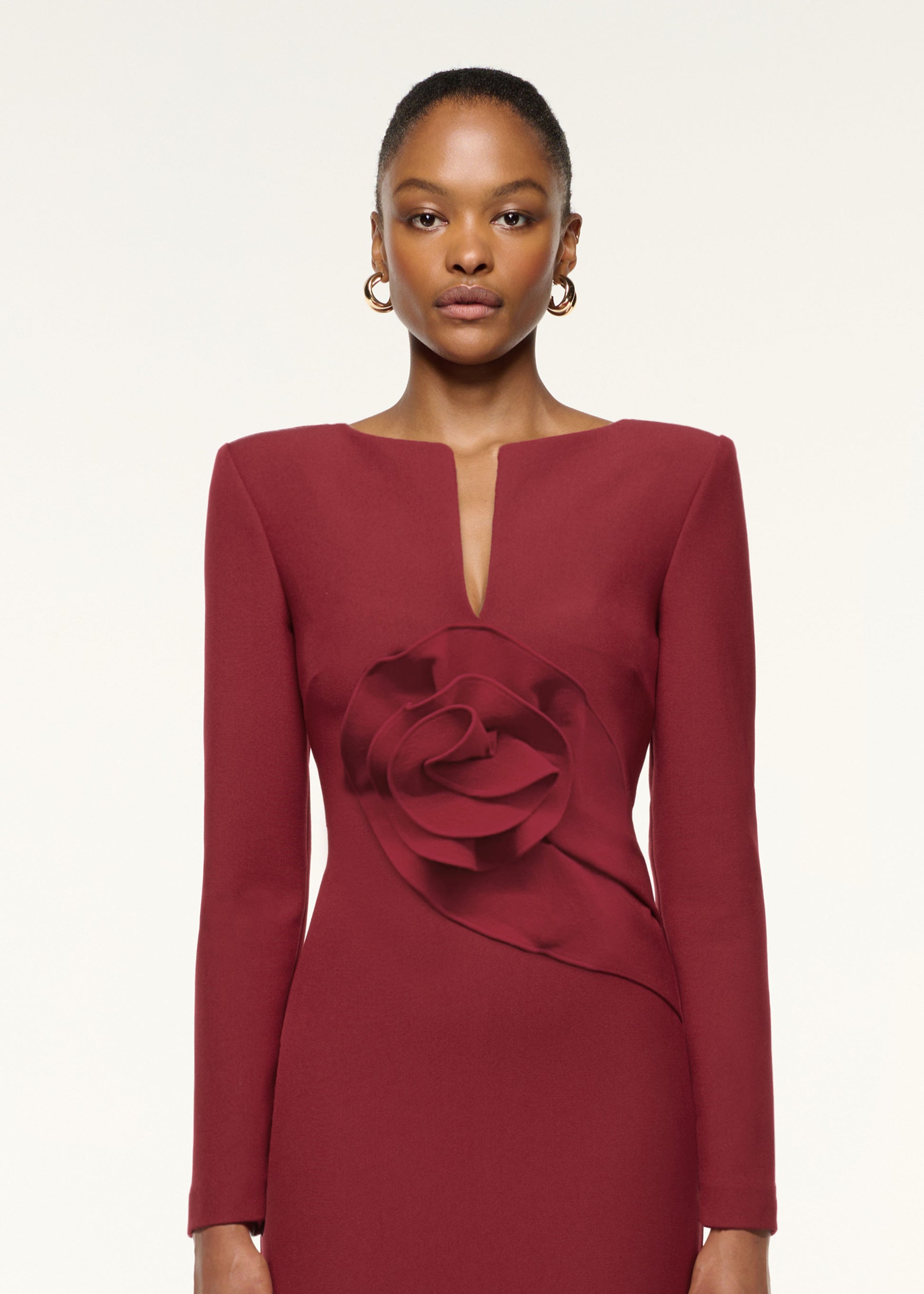 Close up of a model wearing the Flower Detail Evening Gown in Mulberry