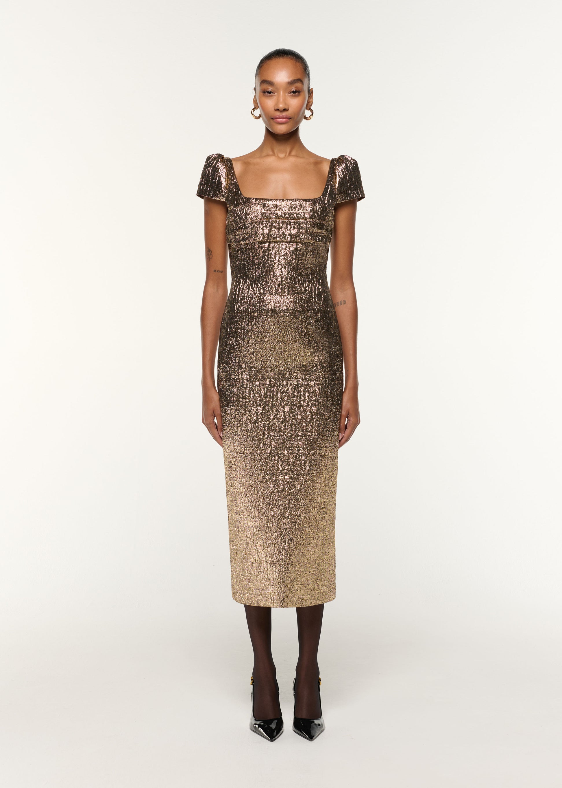 Front view of a model wearing the Pleated Drape Metallic Jacquard Dress in Gold
