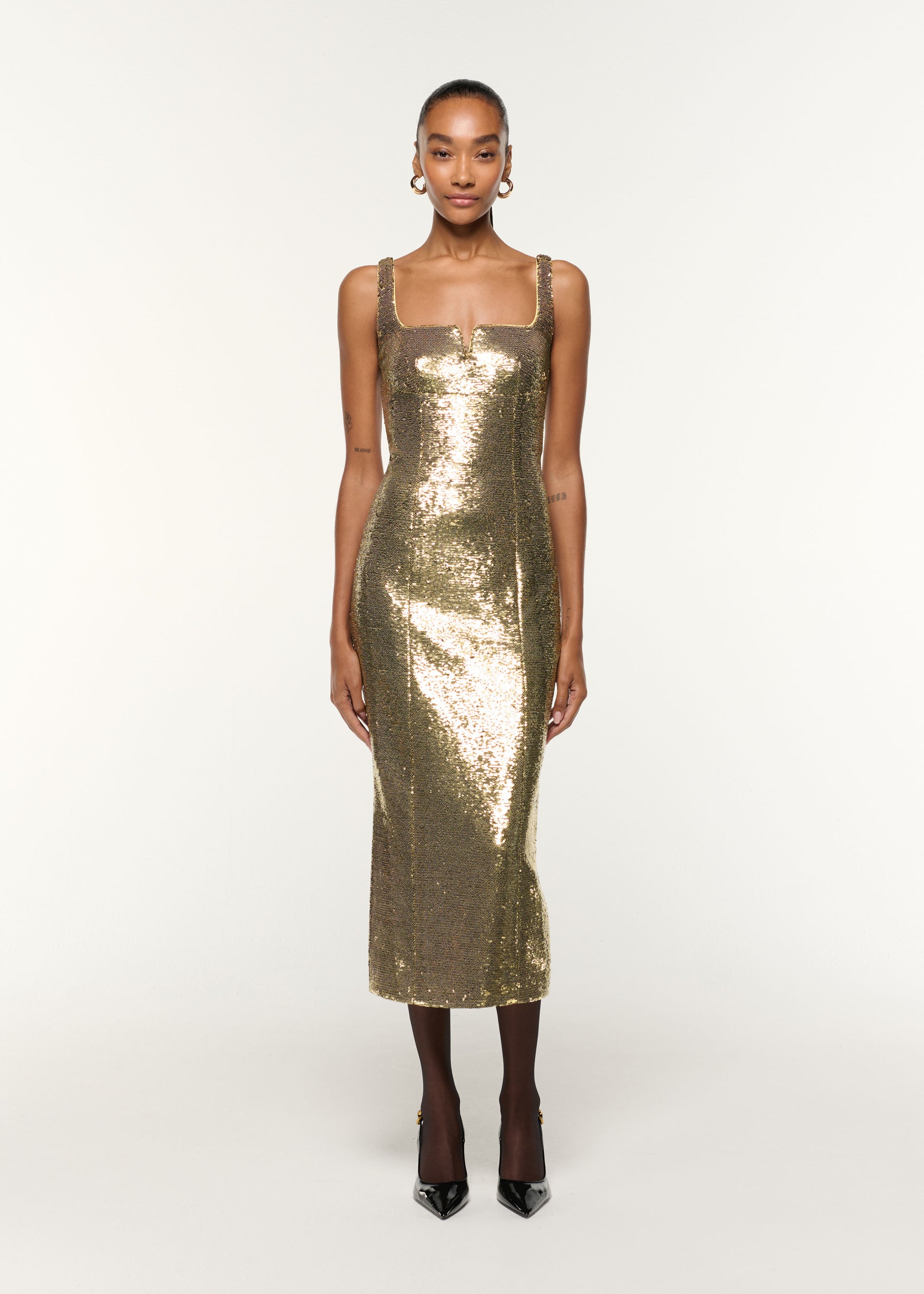 Front view of a model wearing the Square Neckline Sequin Dress in Gold