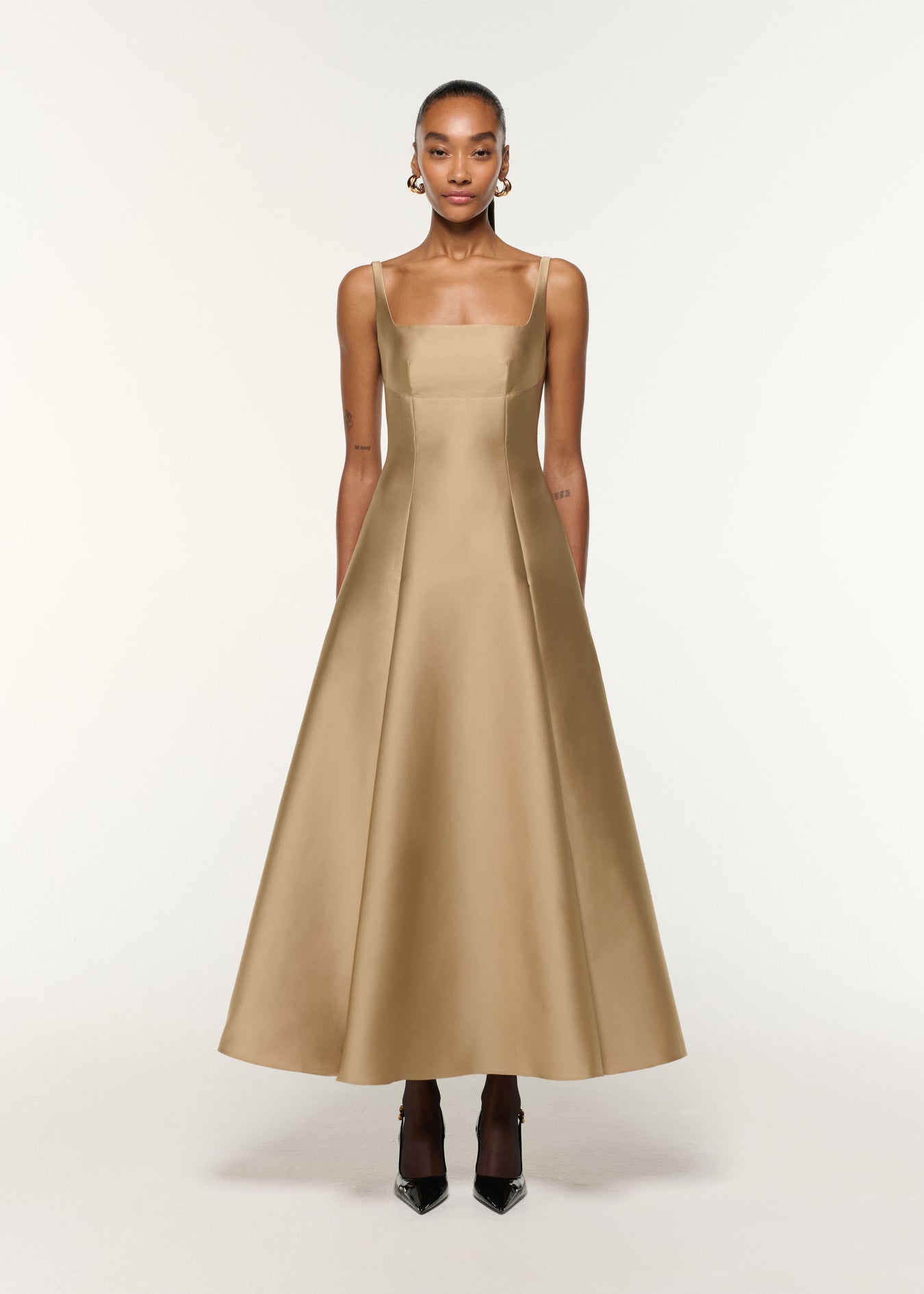 Front view of a model wearing the Square Neckline Taffeta Dress in Gold