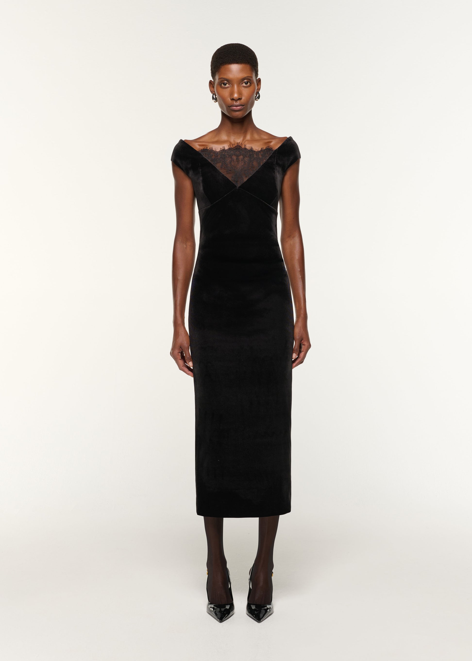Front view of a model wearing the Lace Insert Scuba Velvet Dress in Black