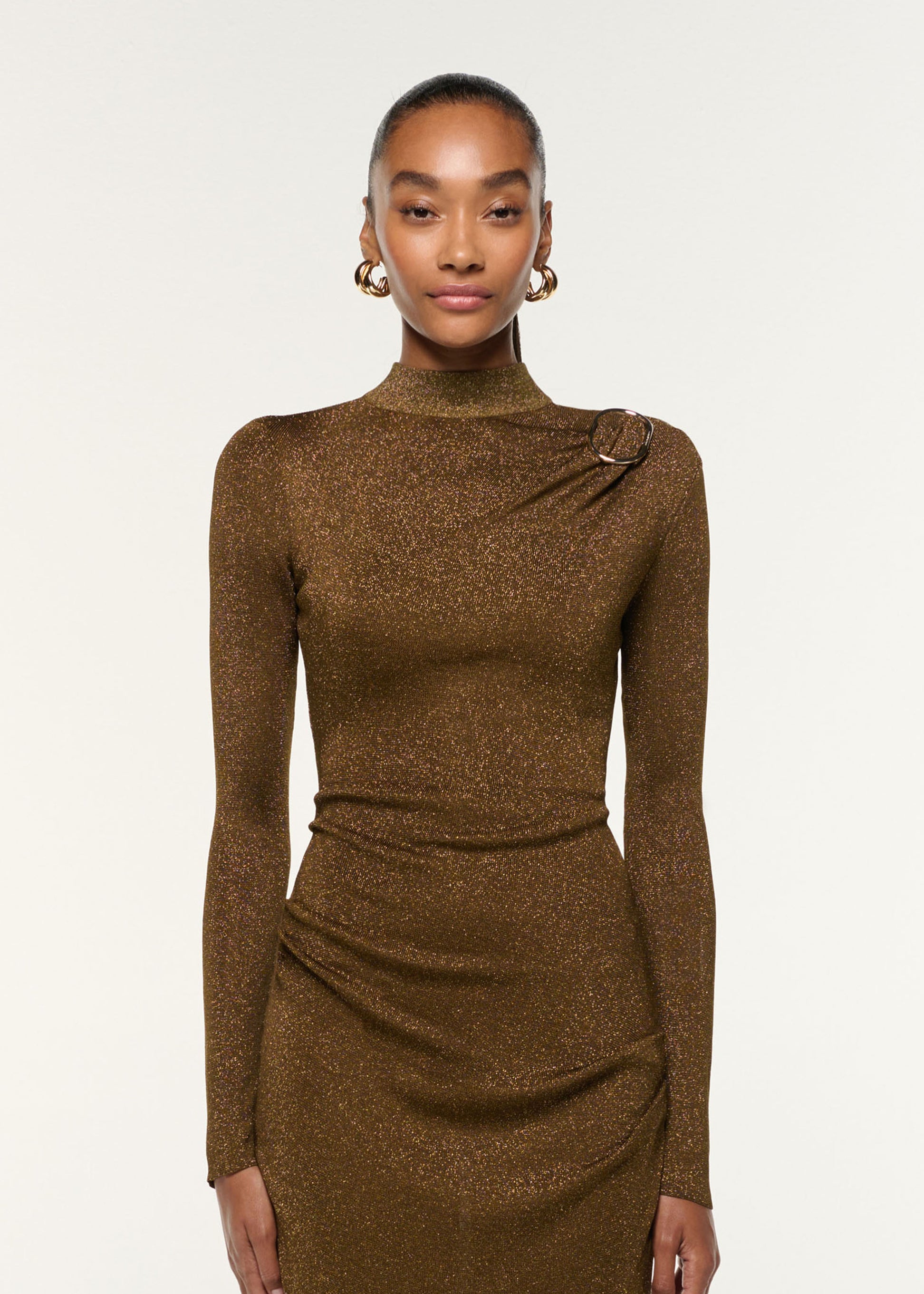 Close up of a model wearing the Lurex Knit Drape & Metal Trim Dress in Khaki