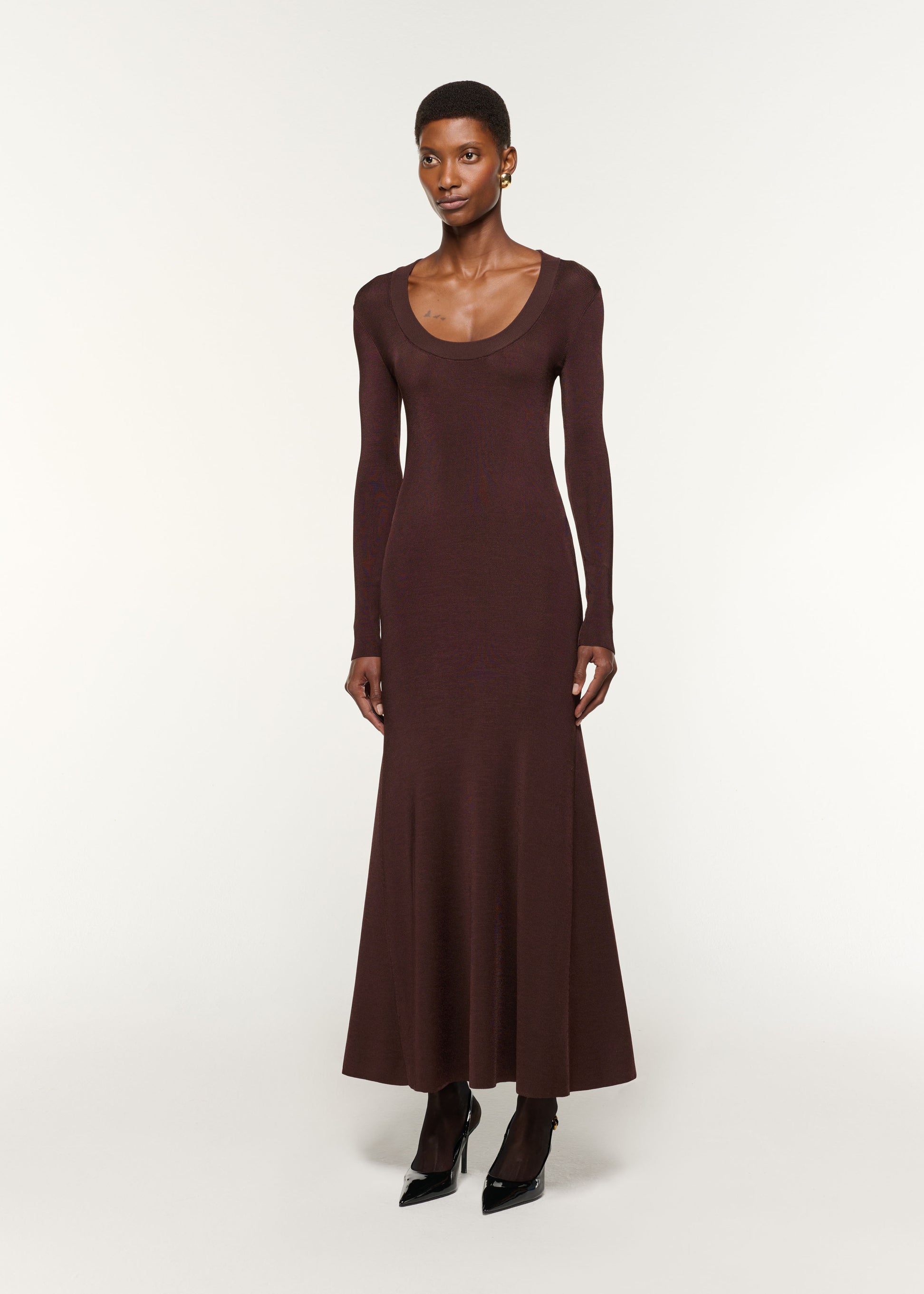 Side view of a model wearing the Scoop Neck Viscose Knit Dress in Brown