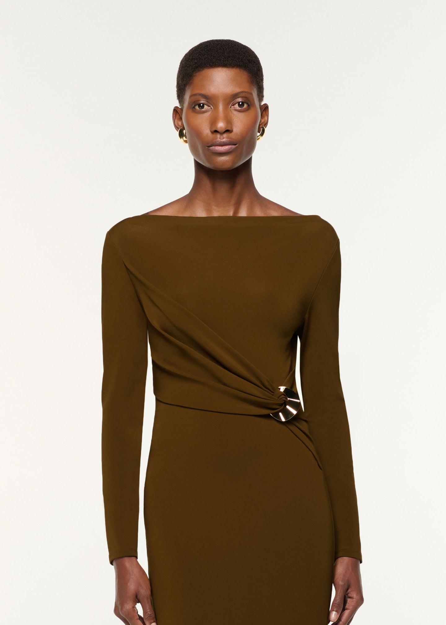 Close up of a model wearing the Jersey Twist Drape & Metal Trim Dress in Brown