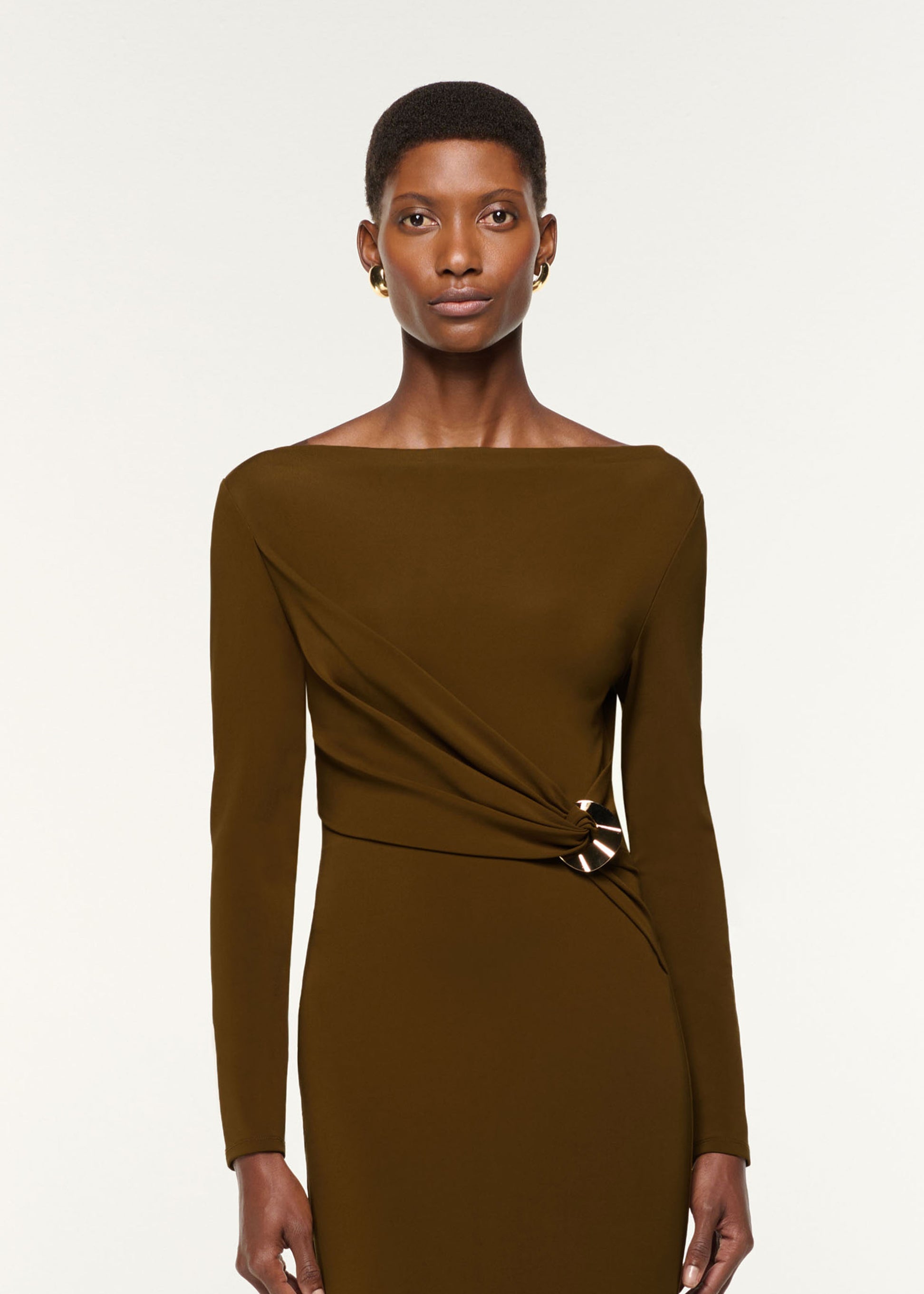 Close up of a model wearing the Jersey Twist Drape & Metal Trim Dress in Brown