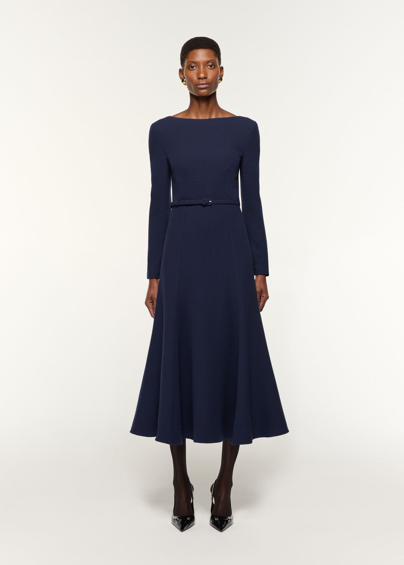 Front view of a model wearing the Boat Neck Wool Crepe Dress in Navy