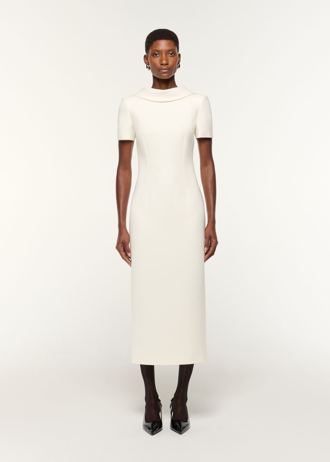 Front view of a model wearing the Collared Crepe Column Midi Dress in Cream
