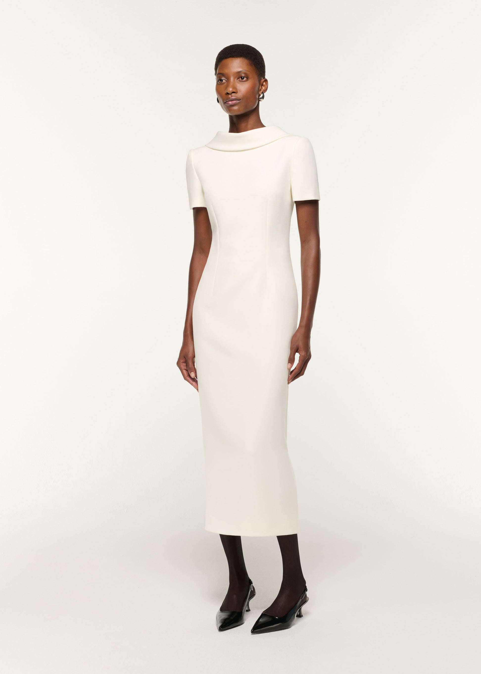 Side view of a model wearing the Collared Crepe Column Midi Dress in Cream
