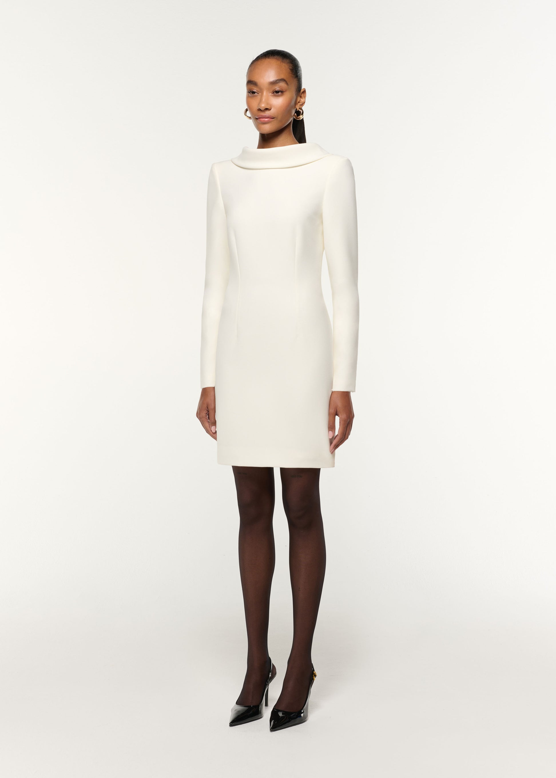 Side view of a model wearing the Collared Crepe Mini Dress in Cream