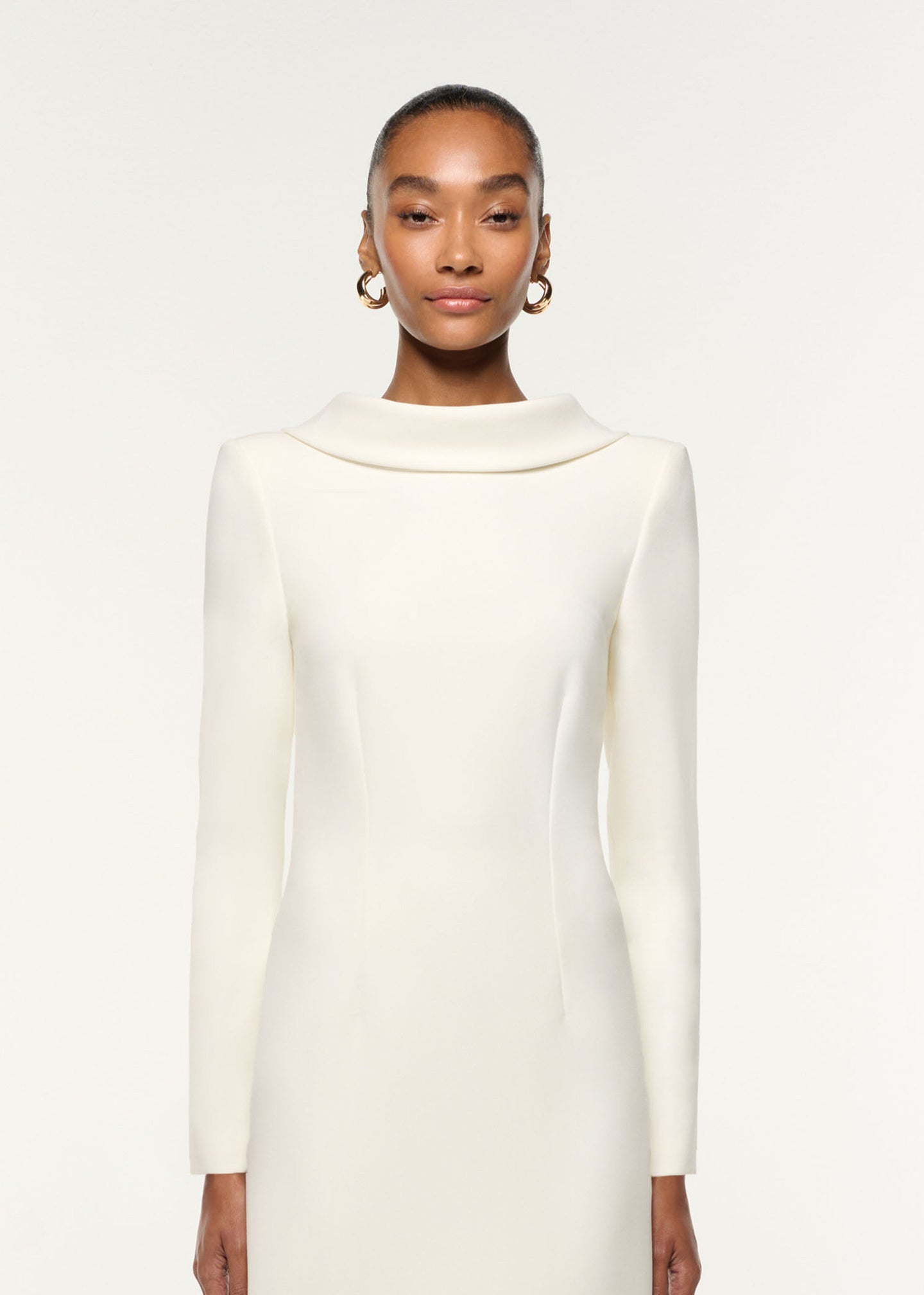 Close up of a model wearing the Collared Crepe Mini Dress in Cream