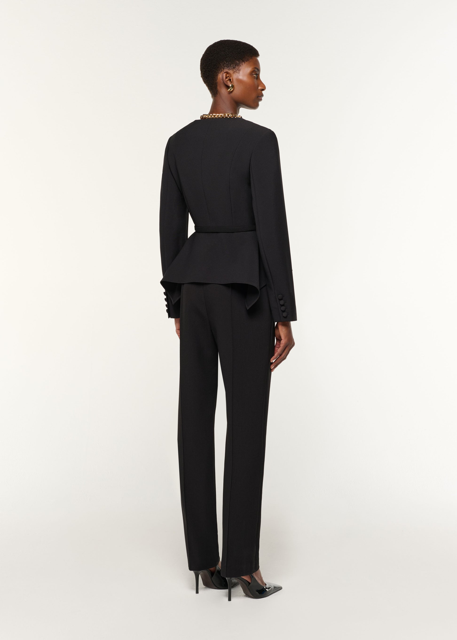 Back view of a model wearing the Crepe Straight Leg Trouser in Black