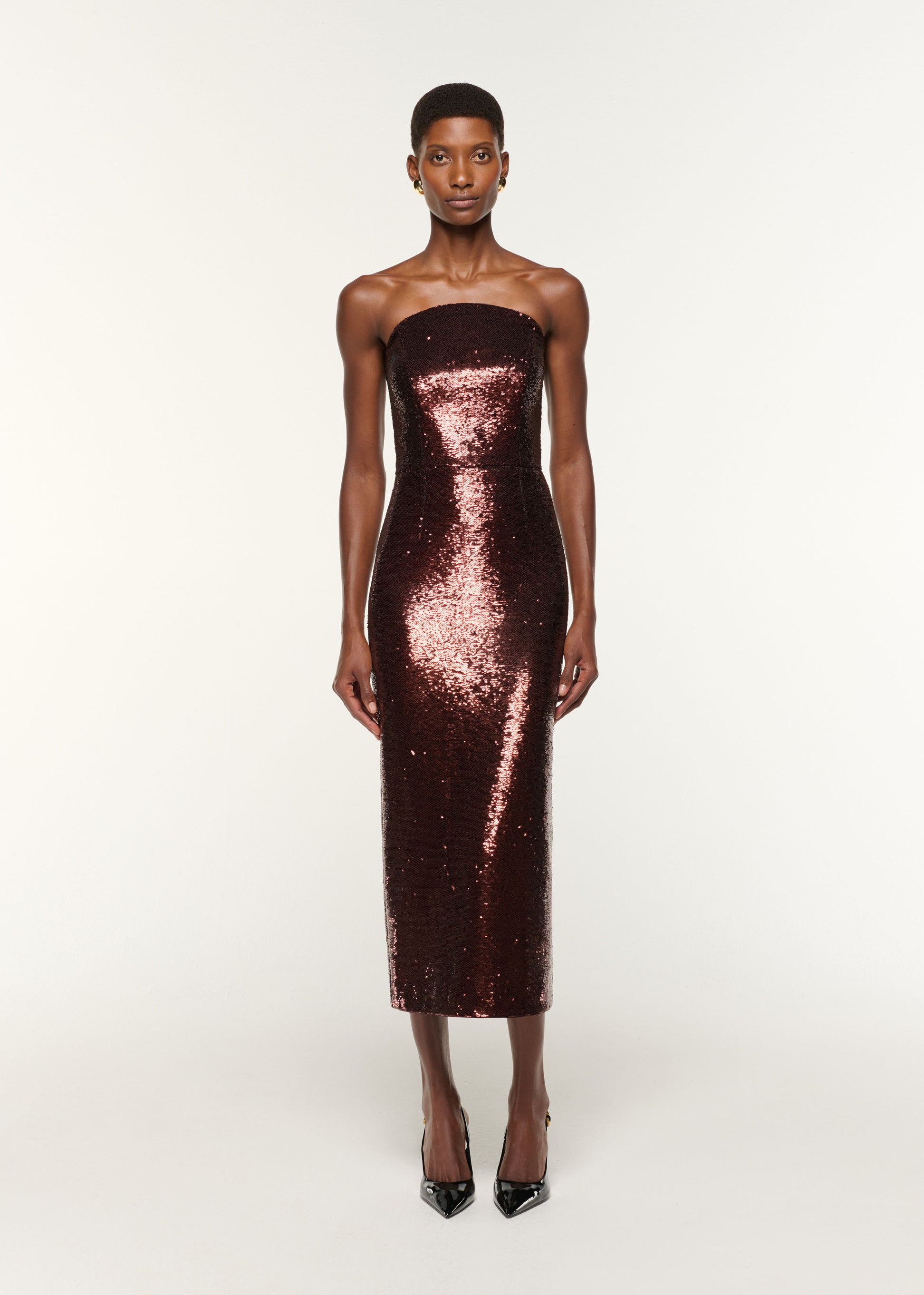 Front view of a model wearing the Curved Neck Sequin Midi Dress in Brown