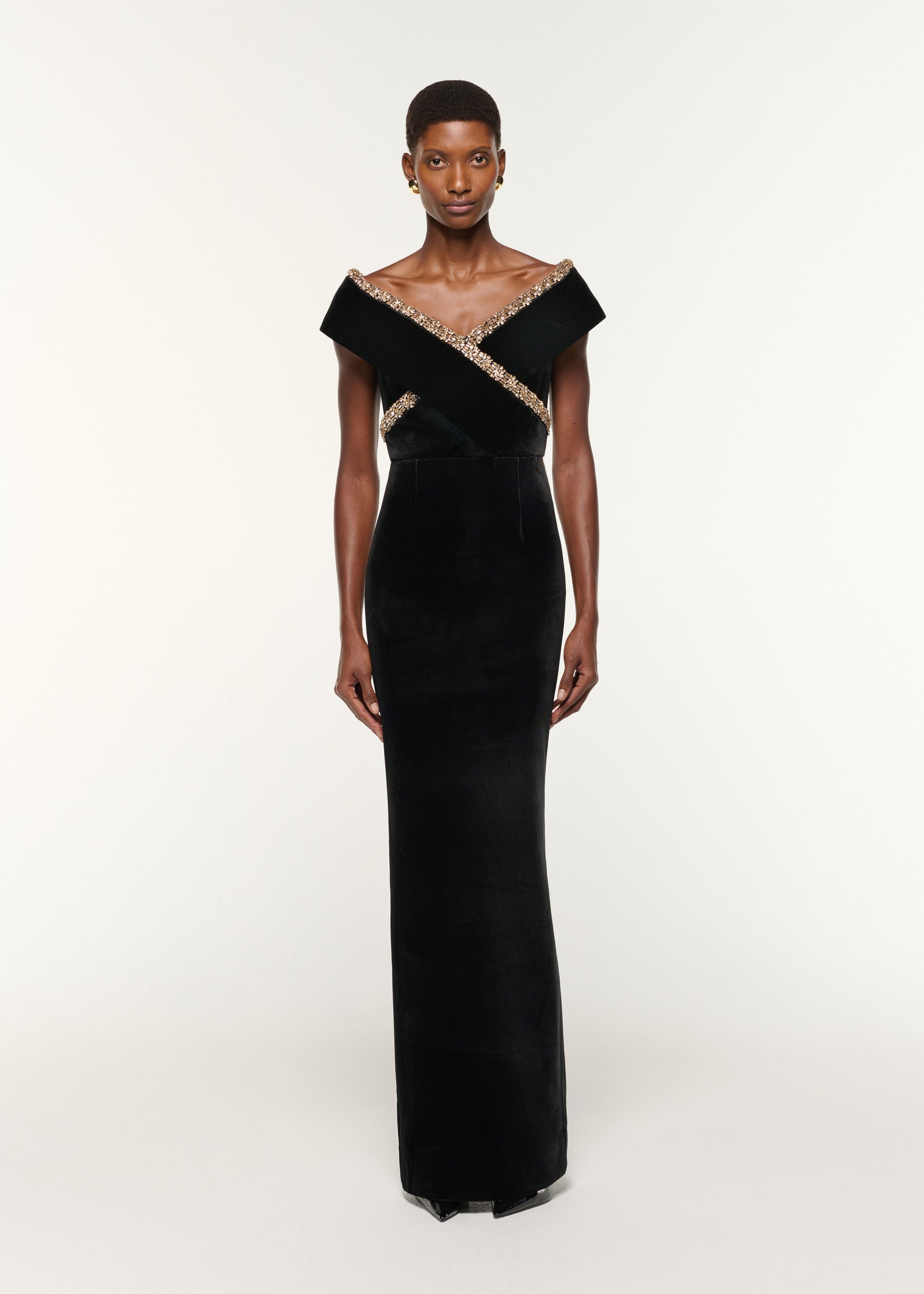 Front view of a model wearing the Velvet Diamante Crossover Gown in Black