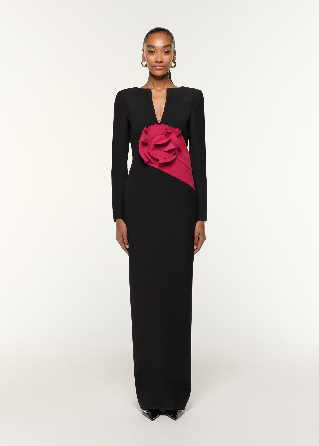 Front view of a model wearing the Flower Drape Crepe Gown in Black