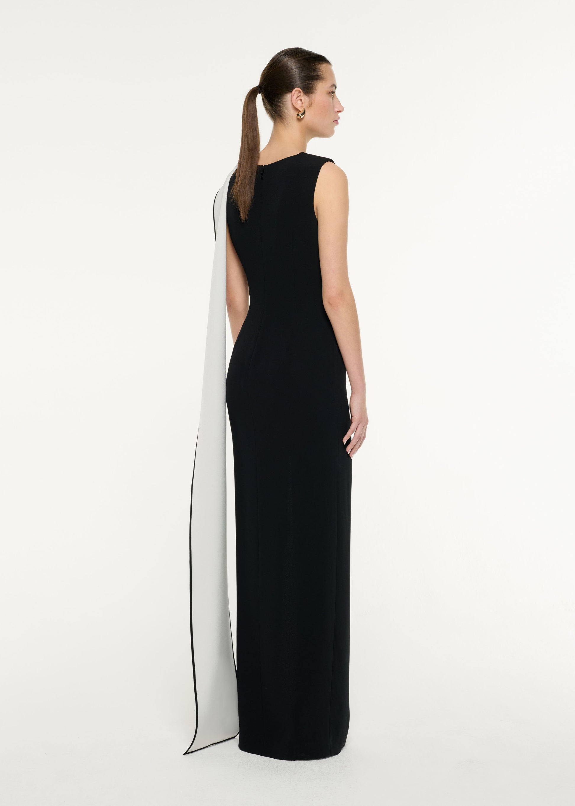 Back view of a model wearing the Satin Crepe Sash Gown in Monochrome