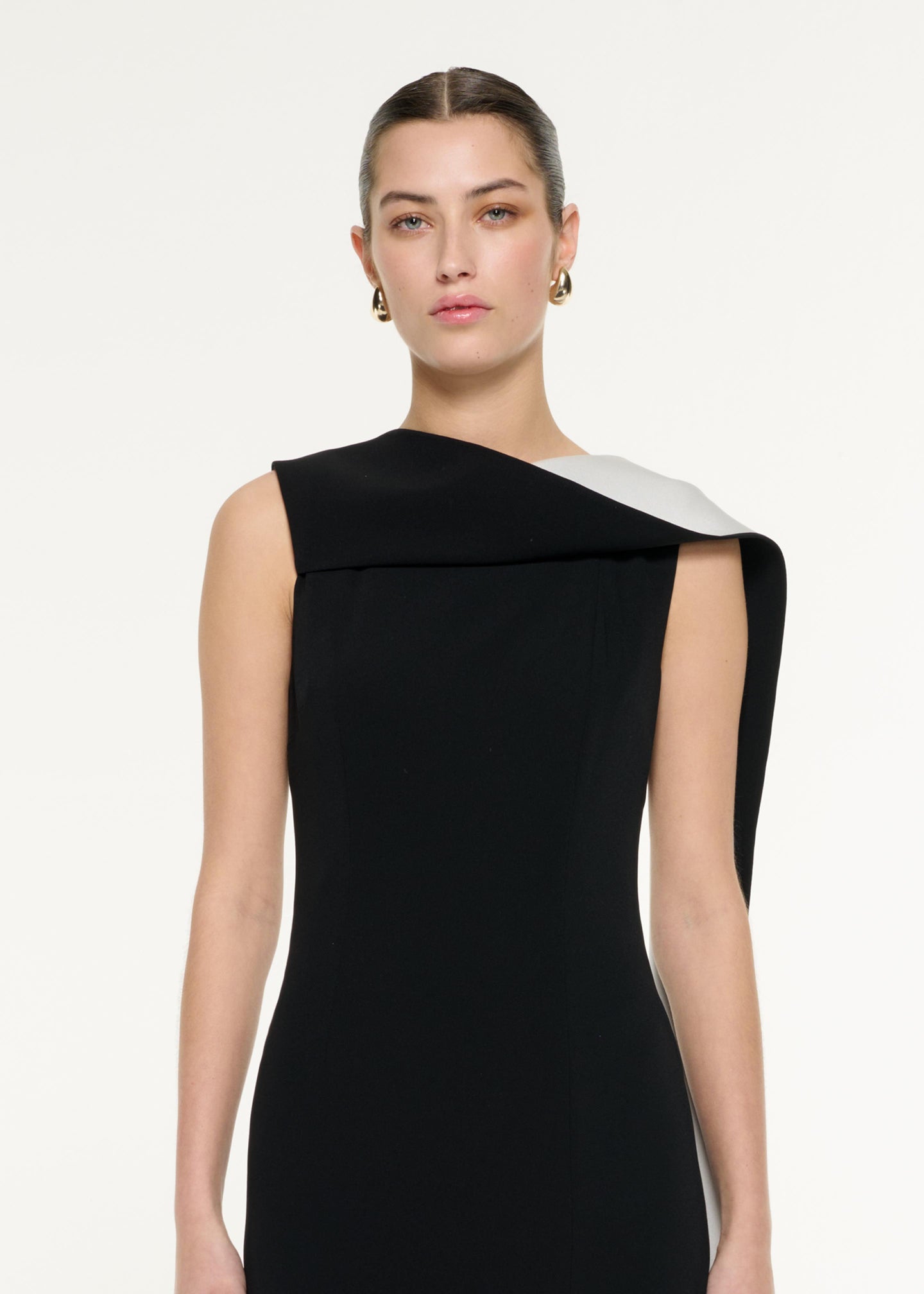 Close up of a model wearing the Satin Crepe Sash Gown in Monochrome