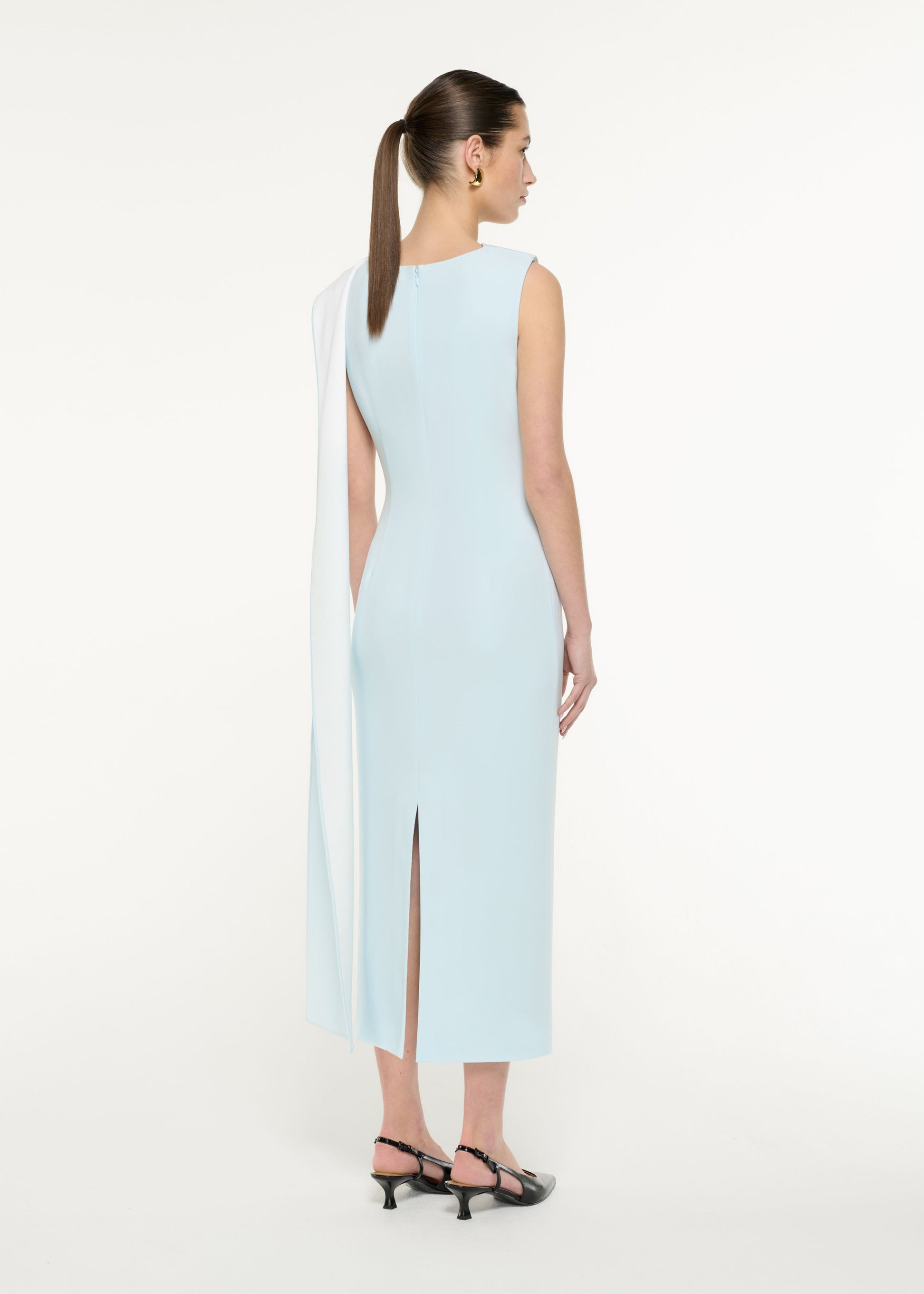 Back view of a model wearing the Satin Crepe Sash Midi Dress in Blue/White