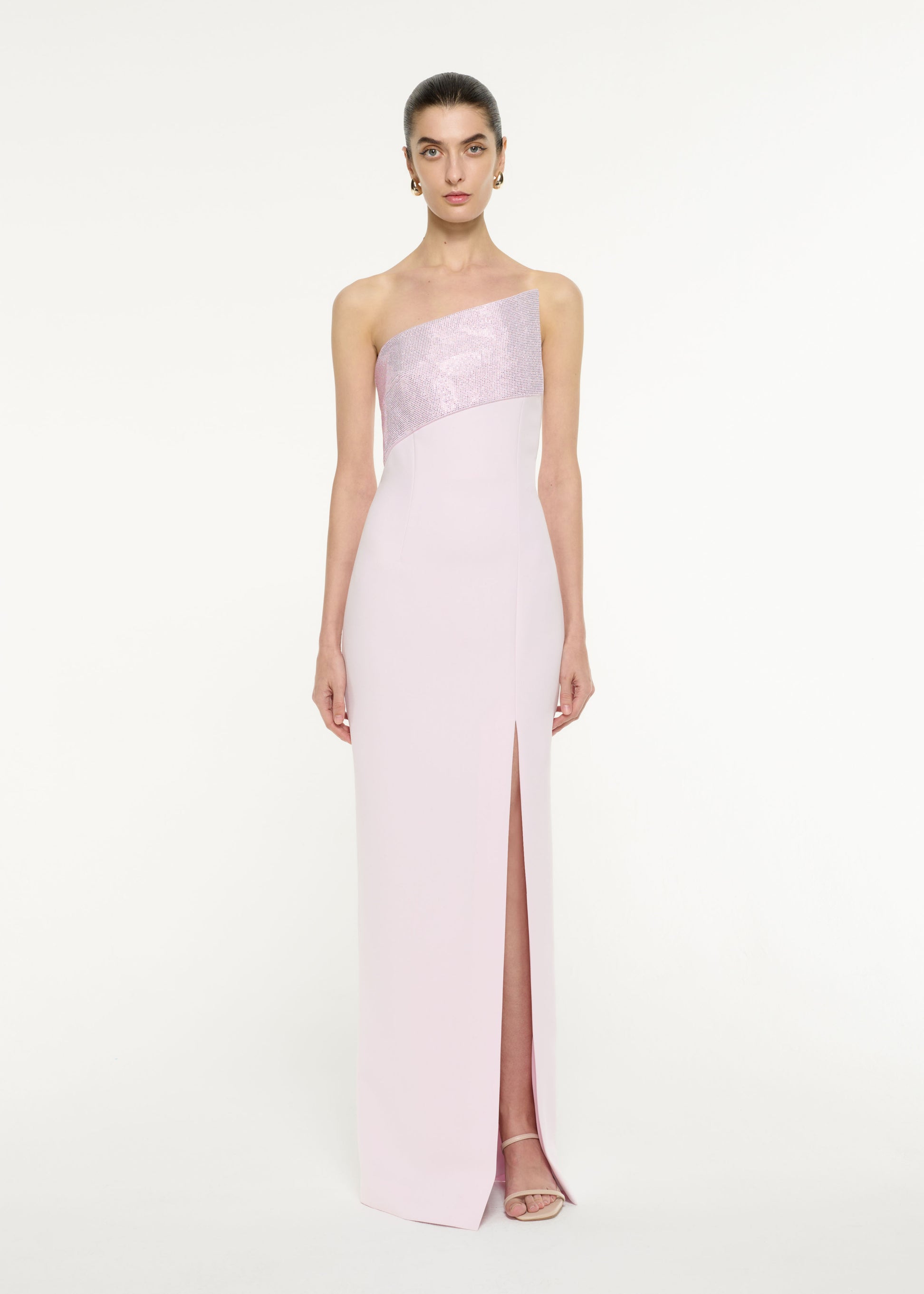 Front view of a model wearing the Asymmetric Diamante Panel Gown in Light Pink