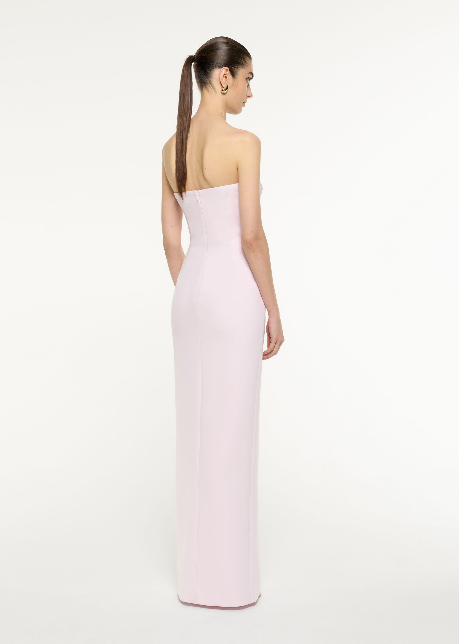 Back view of a model wearing the Asymmetric Diamante Panel Gown in Light Pink