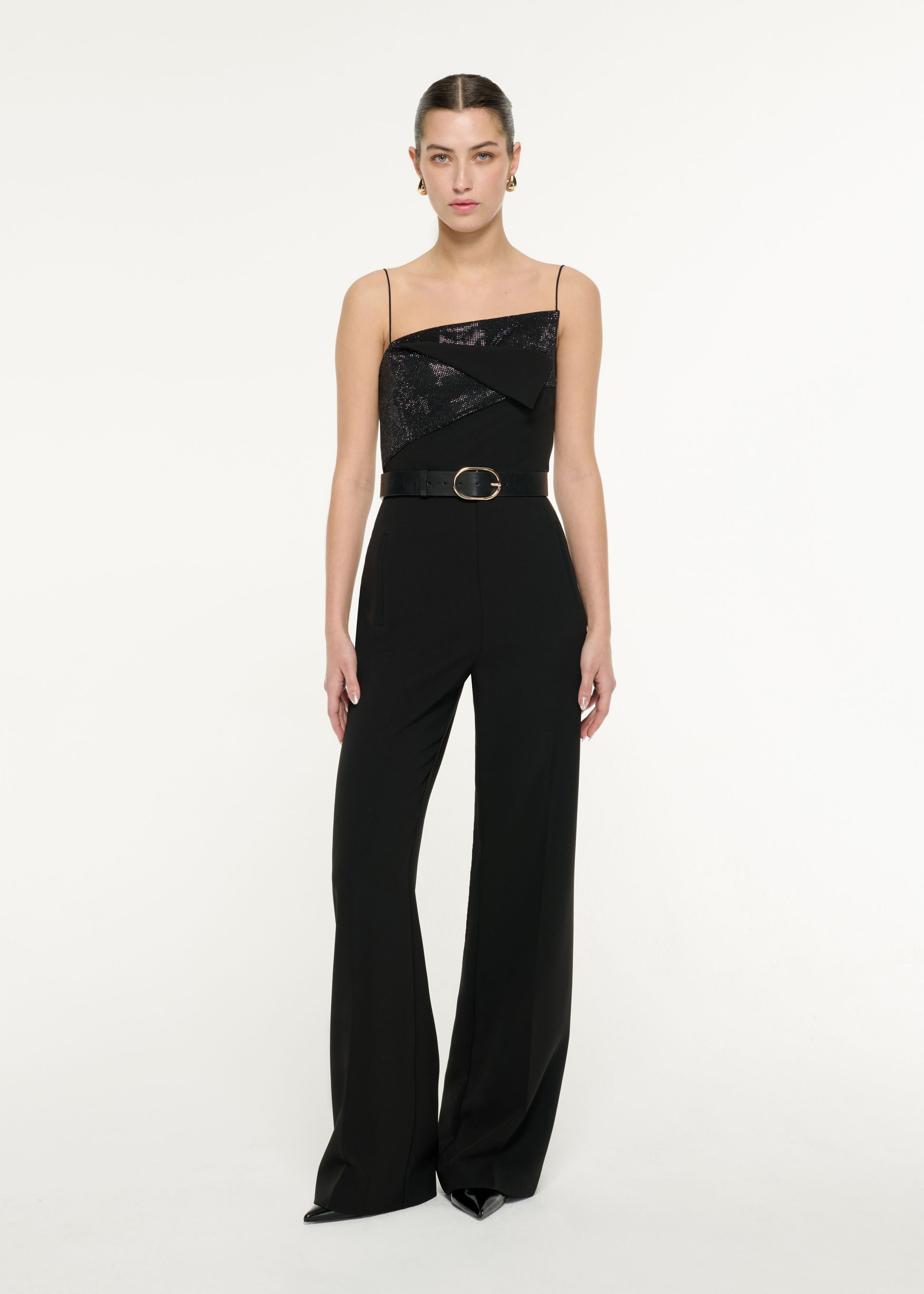 Front view of a model wearing the Diamante Panel Jumpsuit in Black