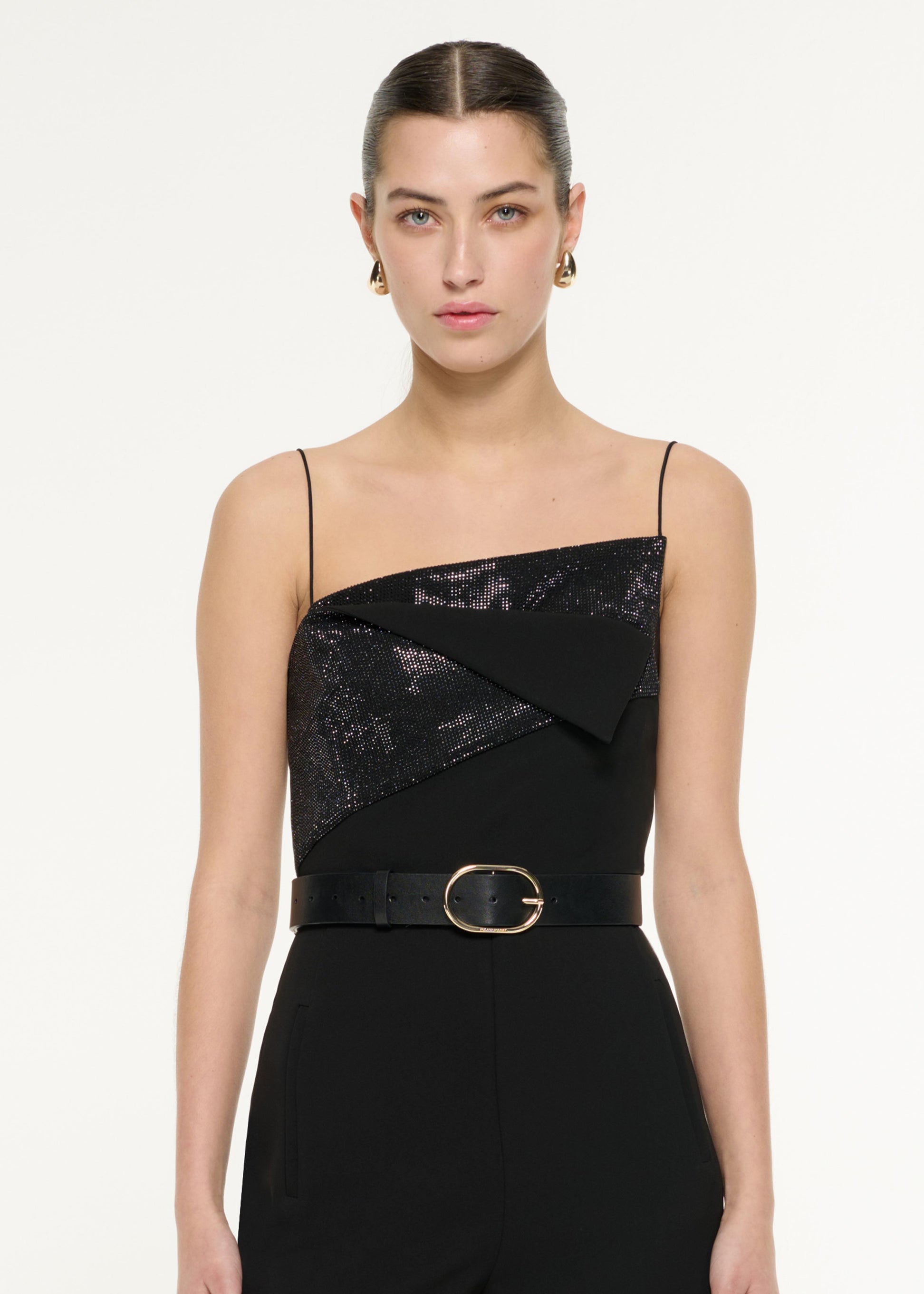 Close up of a model wearing the Diamante Panel Jumpsuit in Black