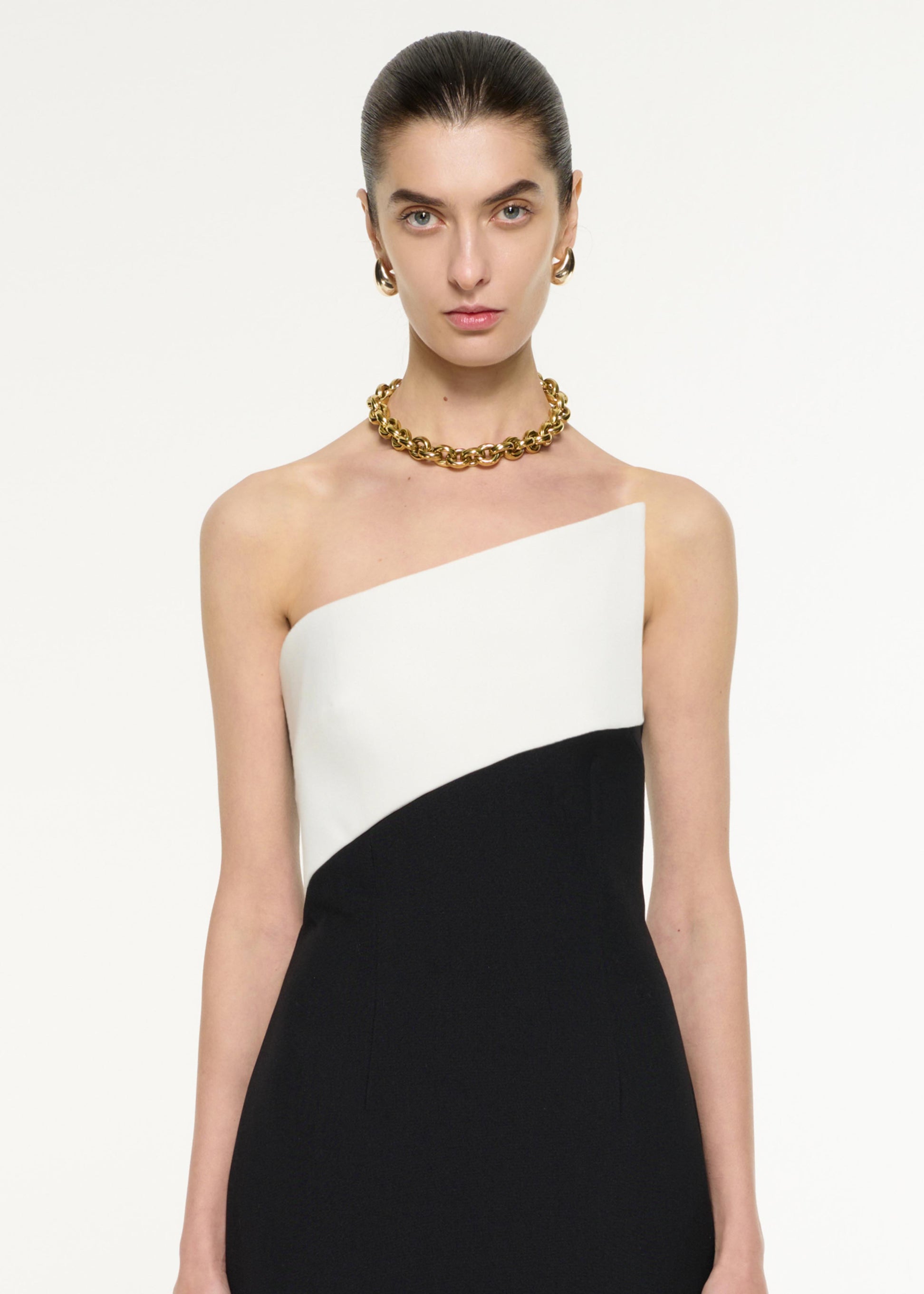 Close up of a model wearing the Contrast Panel Midi Dress in Monochrome