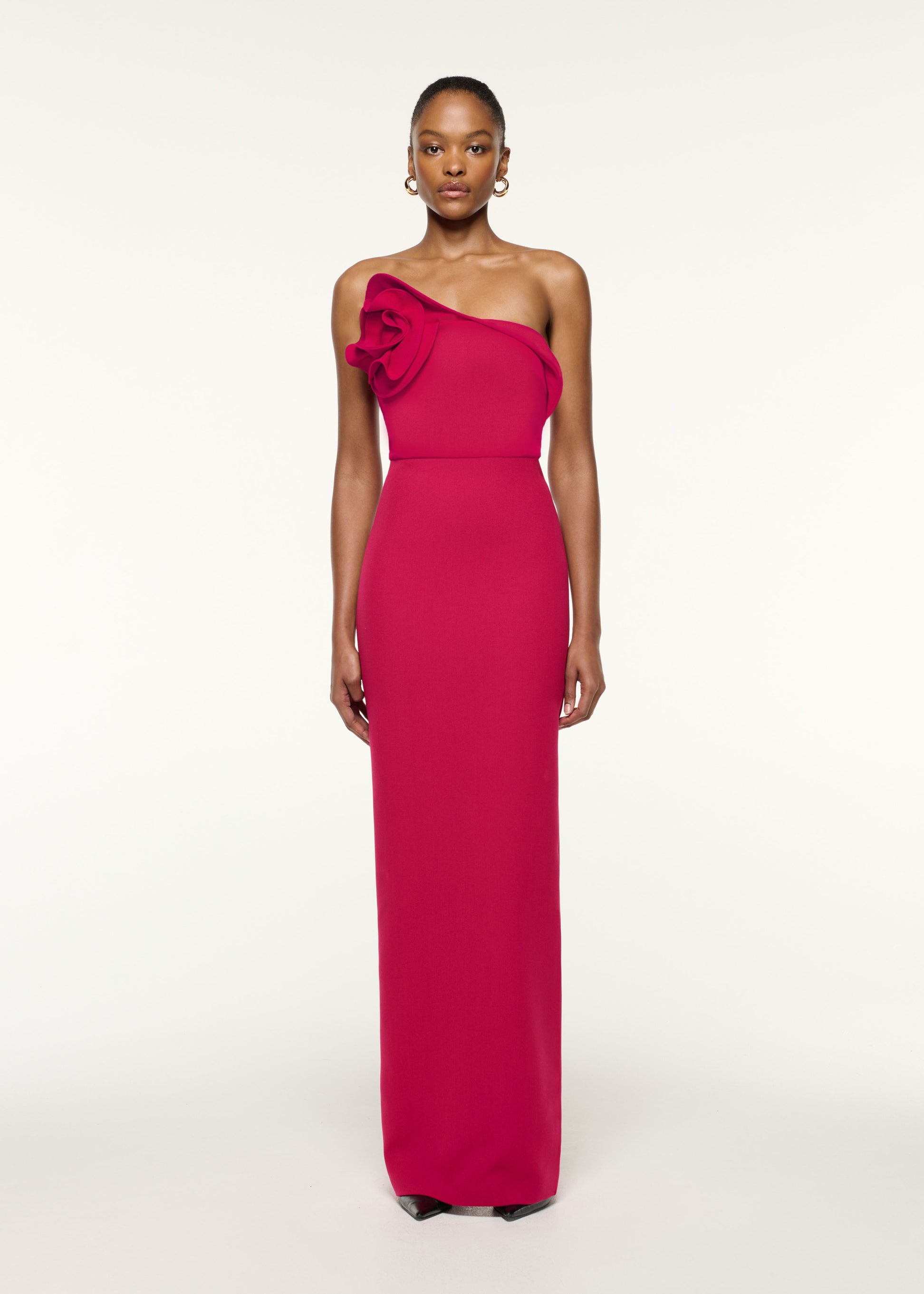 Front view of a model wearing the Flower Detail Strapless Evening Gown in Hot Pink