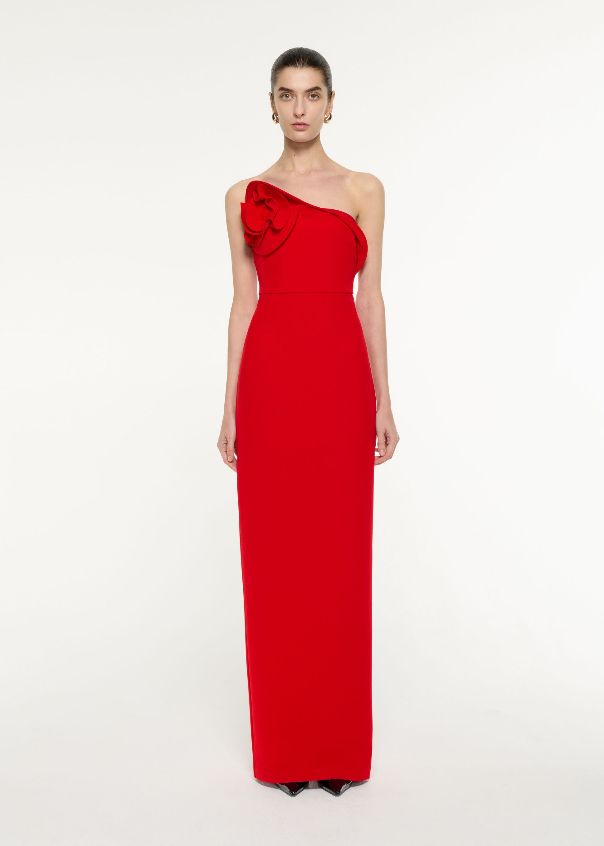 Front view of a model wearing the Flower Drape Crepe Gown in Red