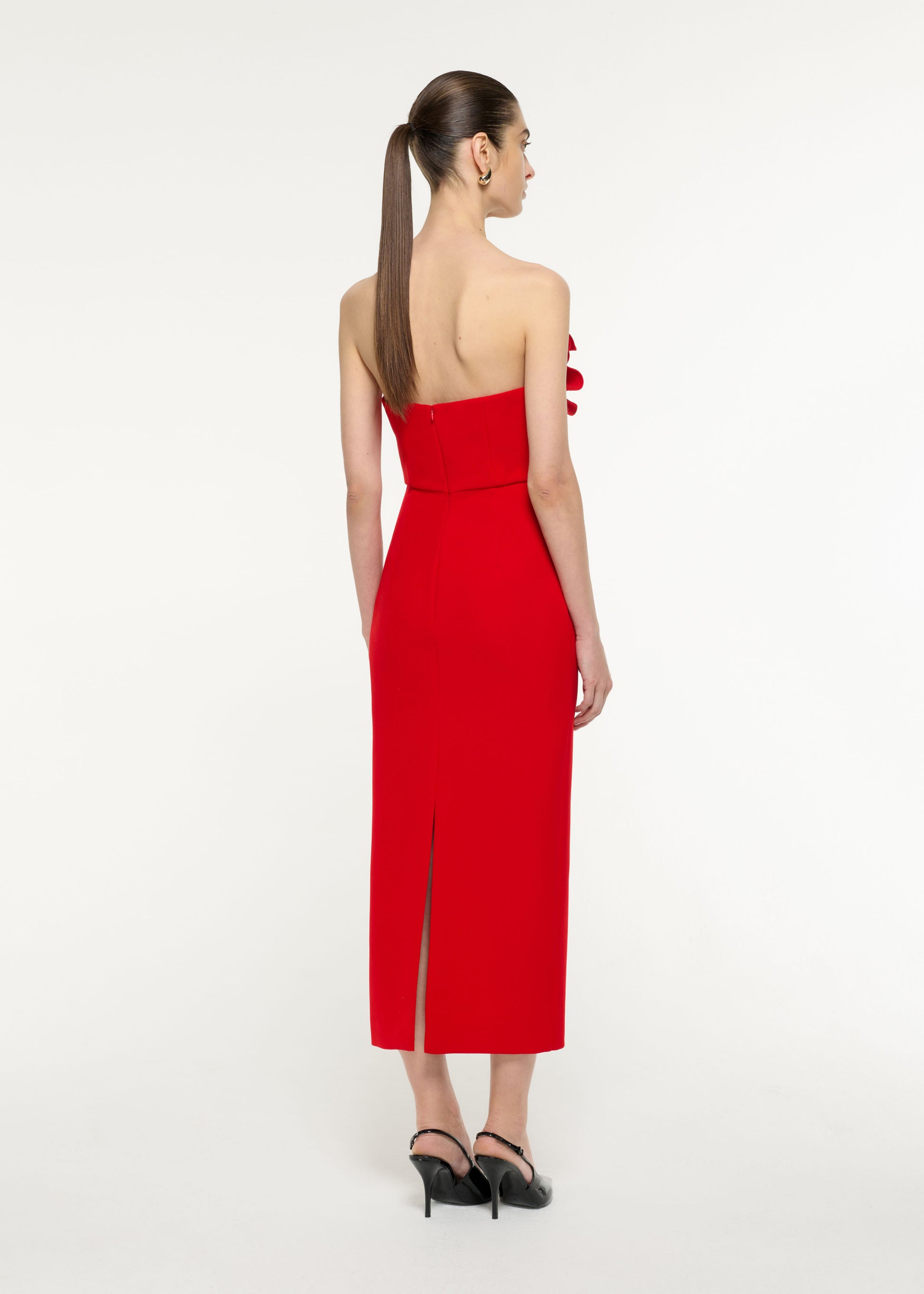 Back view of a model wearing the Flower Drape Midi Dress in Red