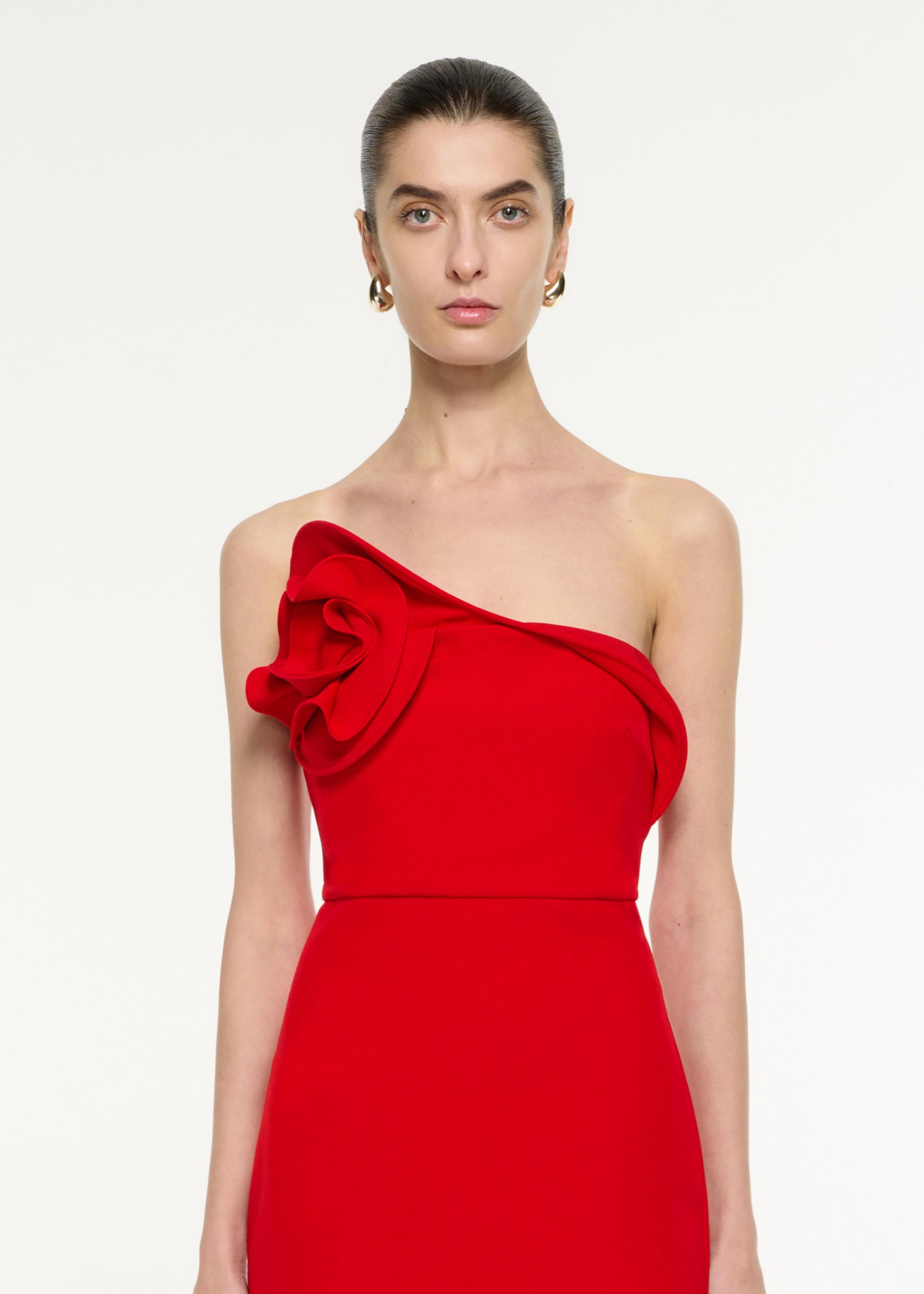 Close up of a model wearing the Flower Drape Midi Dress in Red