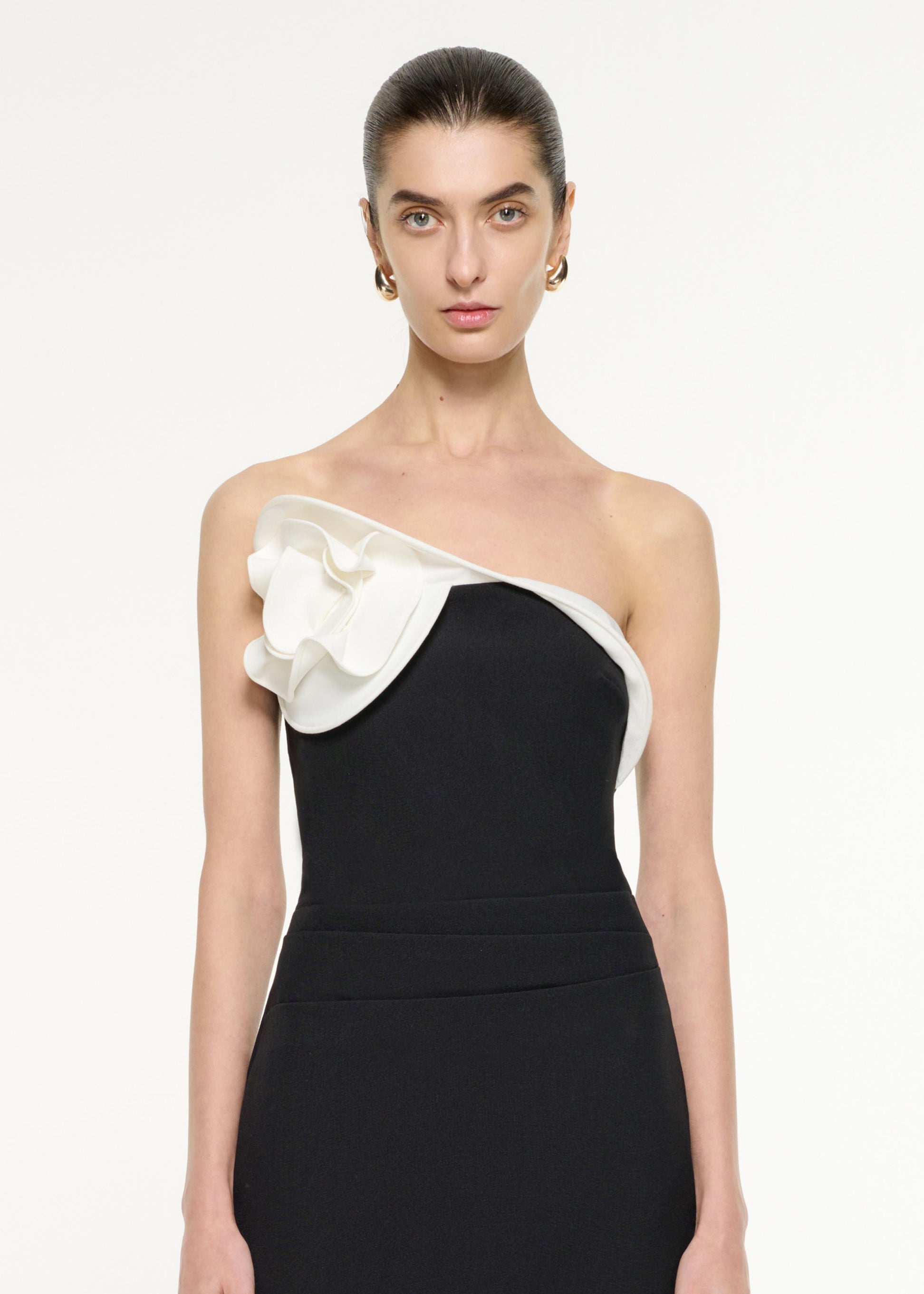 Close up of a model wearing the Flower Drape Mini Dress in Monochrome