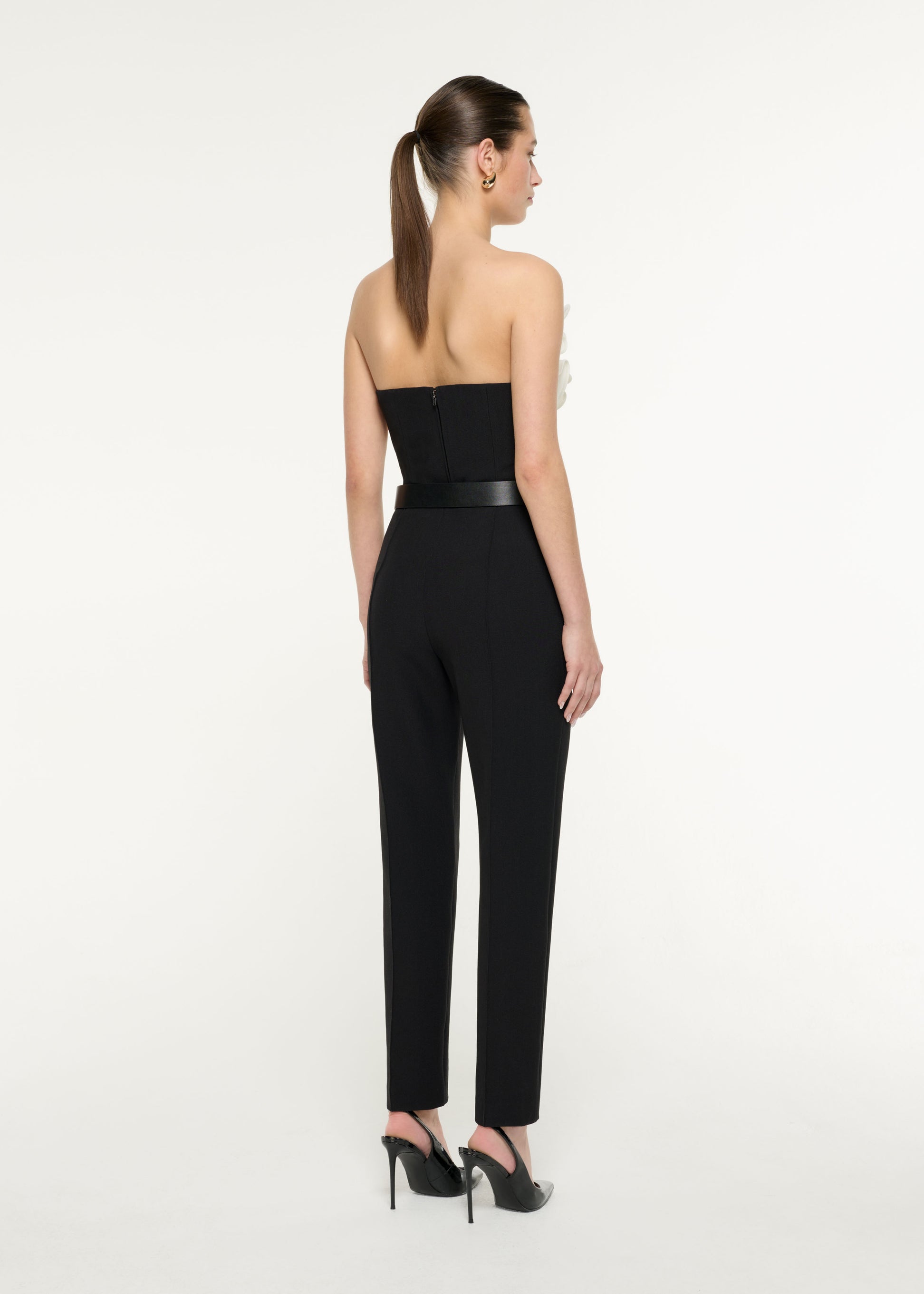 Back view of a model wearing the Flower Crepe Top in Monochrome