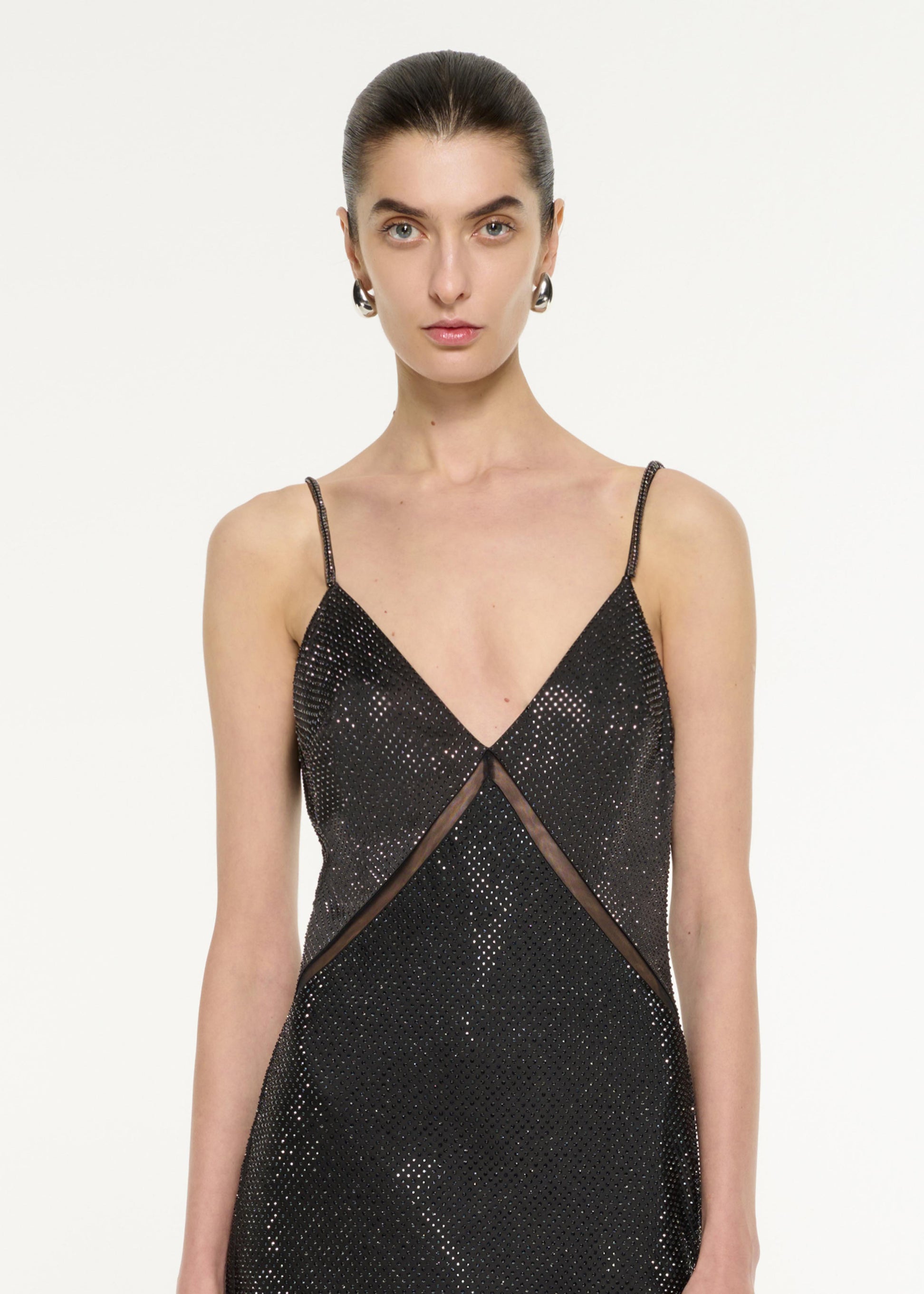 Close up of a model wearing the Satin Diamante Gown in Black