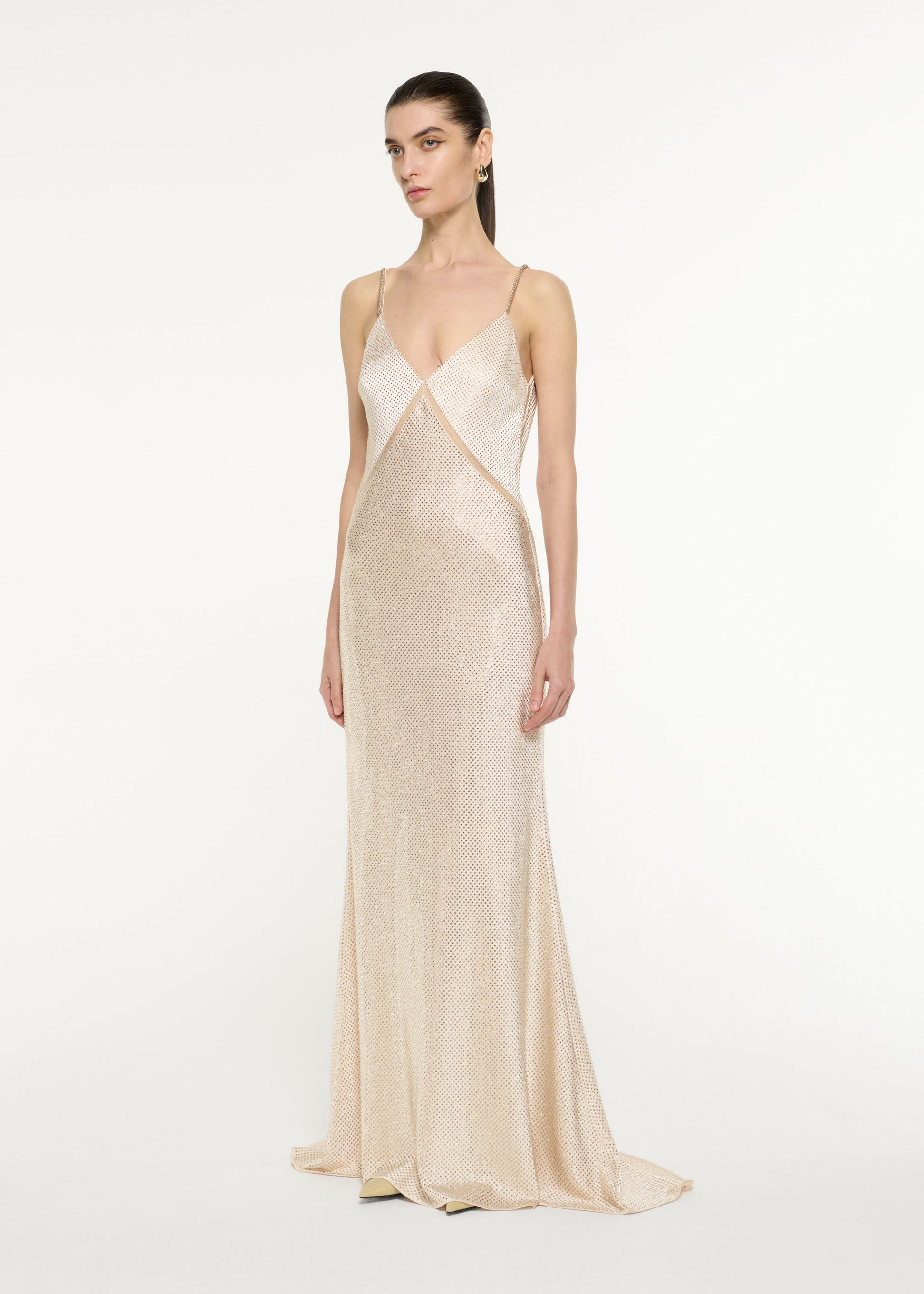 Side view of a model wearing the Satin Diamante Gown in Champagne