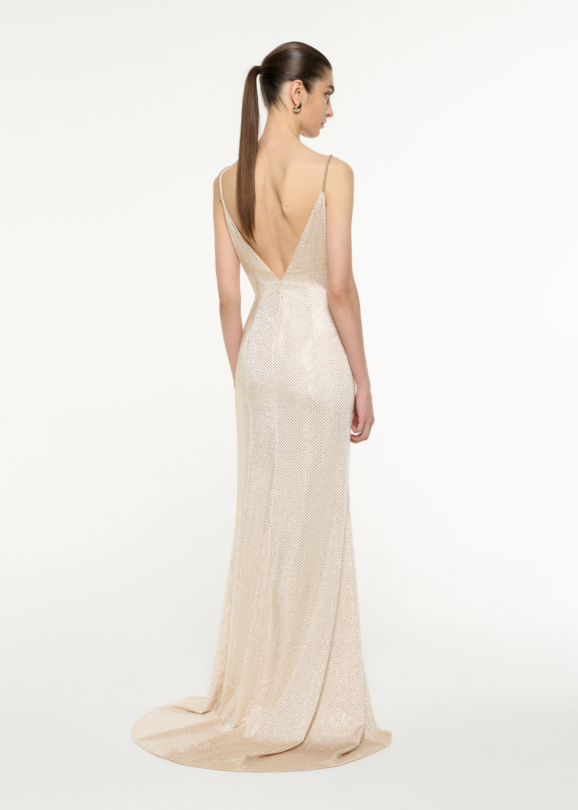 Back view of a model wearing the Satin Diamante Gown in Champagne