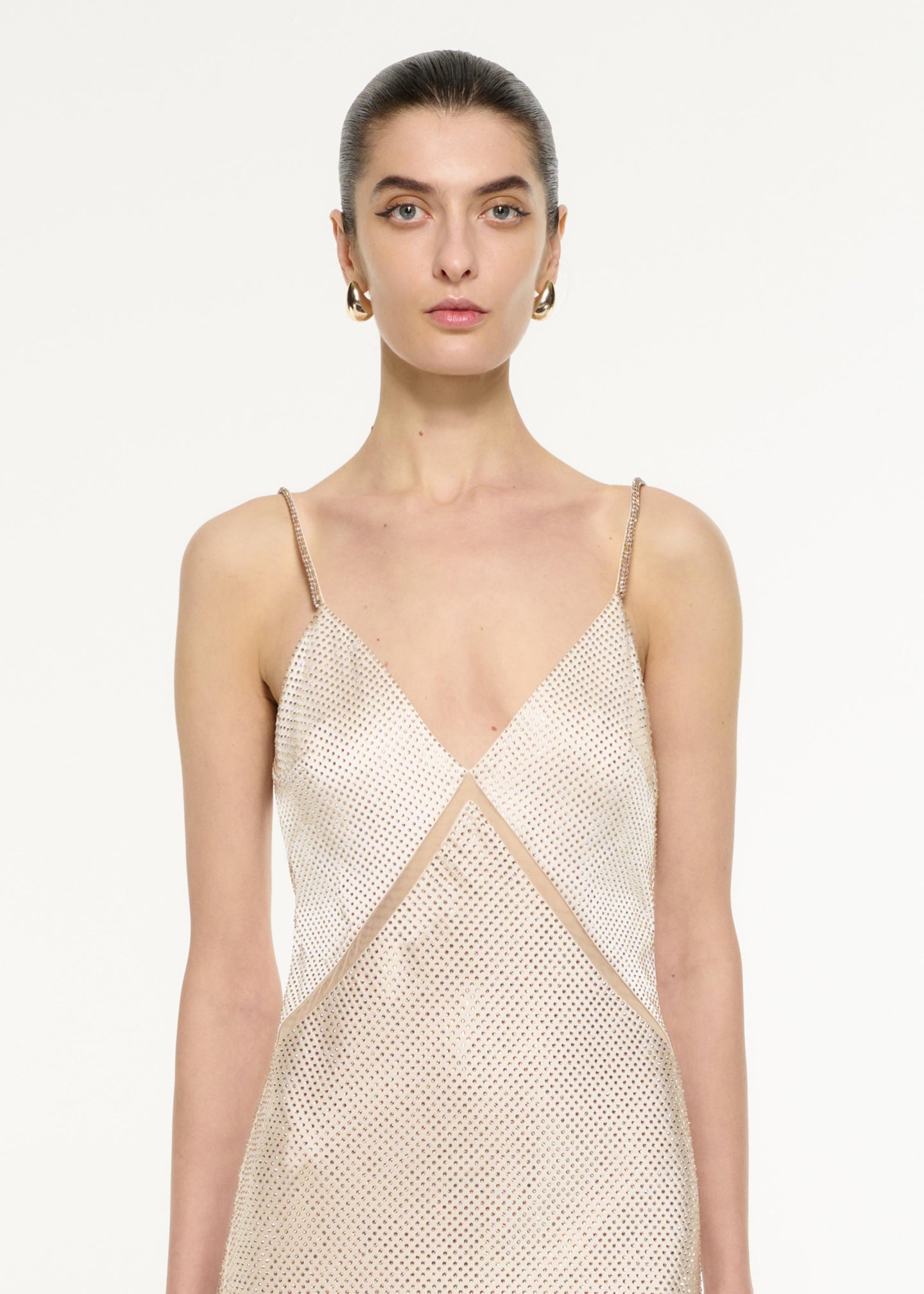 Close up of a model wearing the Satin Diamante Gown in Champagne