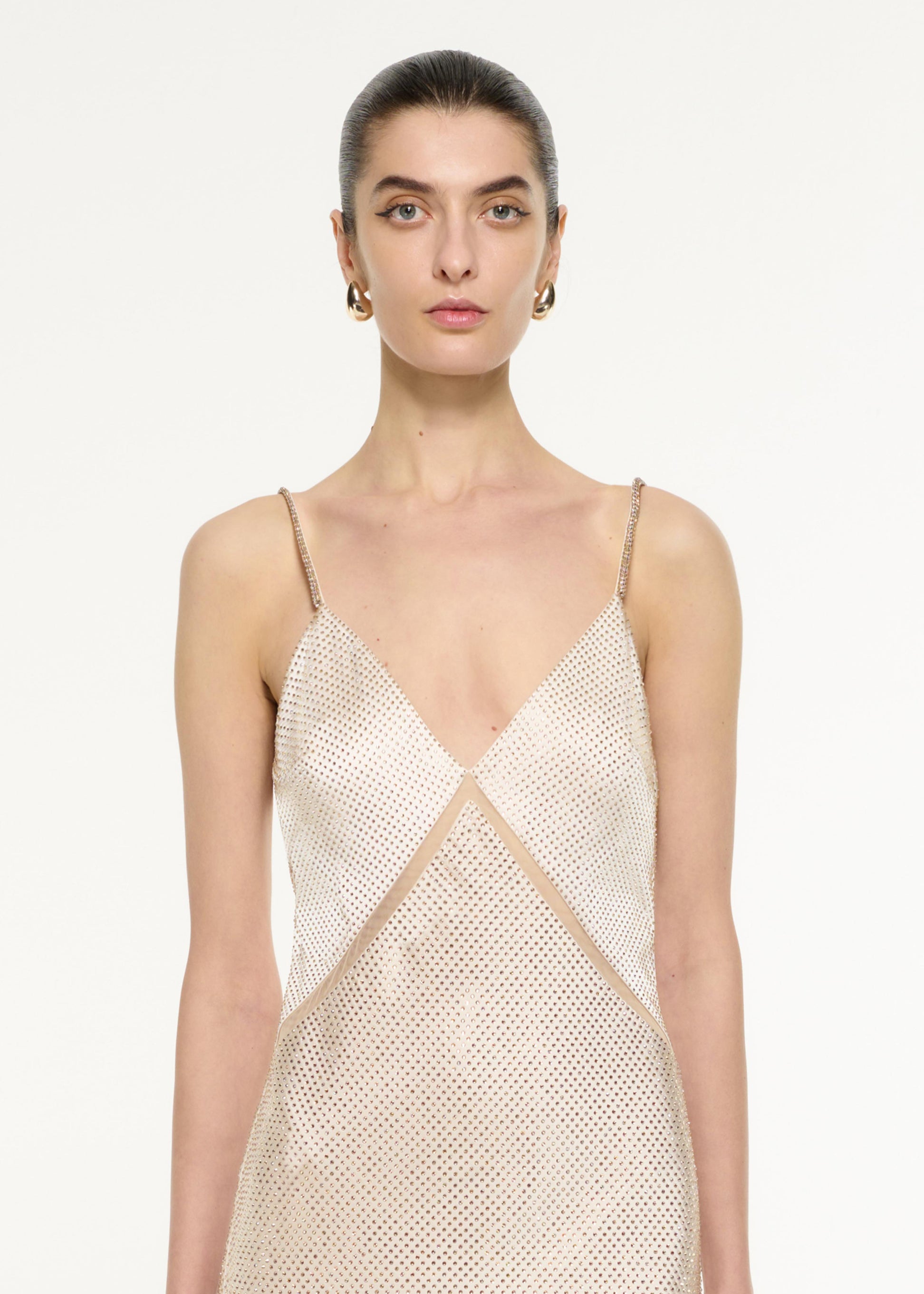 Close up of a model wearing the Satin Diamante Gown in Champagne