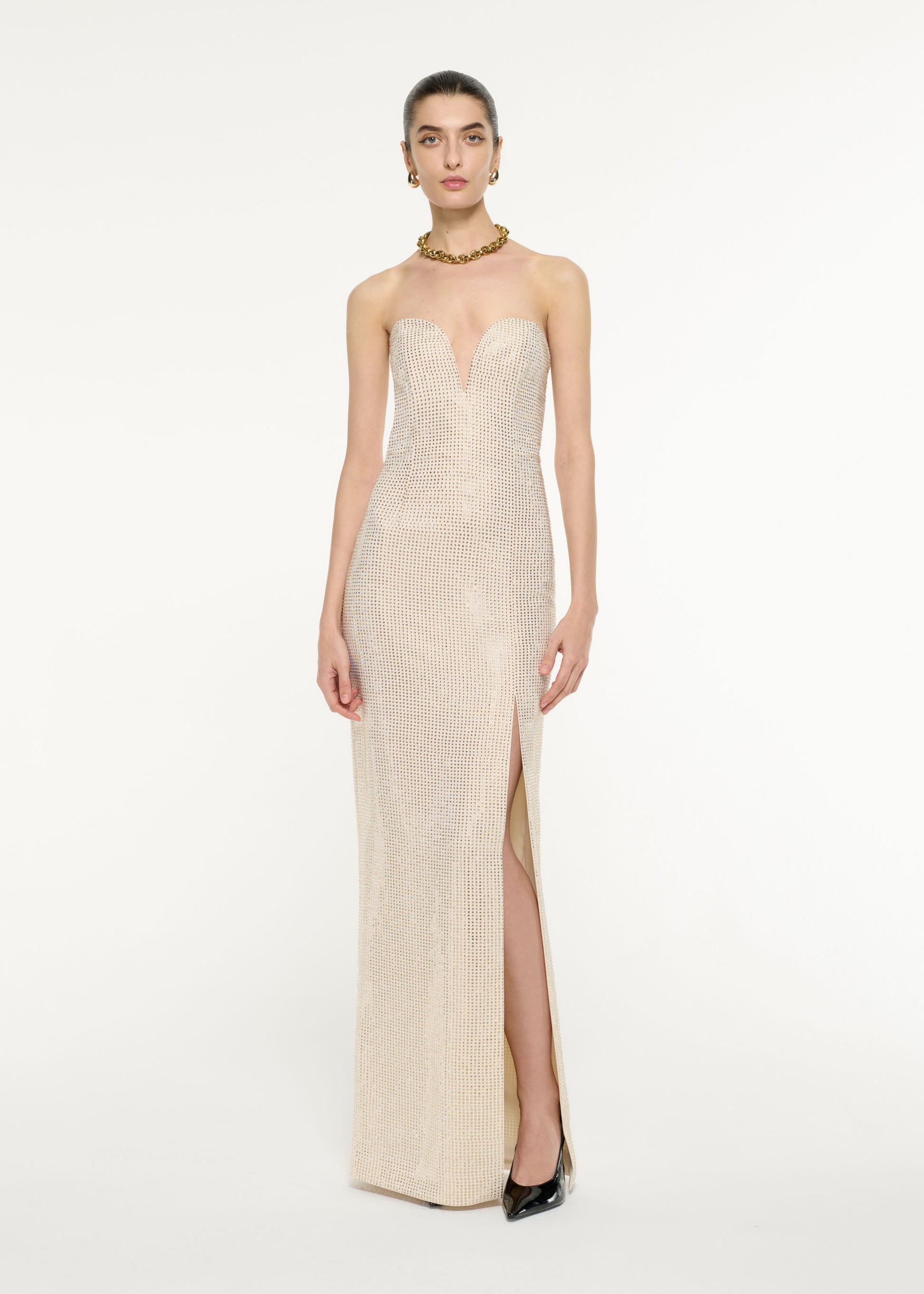 Front view of a model wearing the Diamante Embellished Gown in Champagne