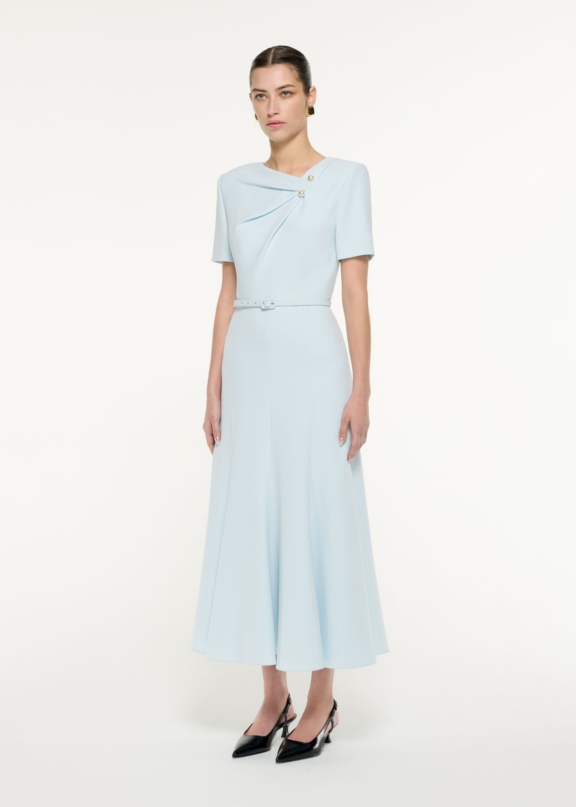 Side view of a model wearing the Tri-fold Belted Midi Dress in Blue