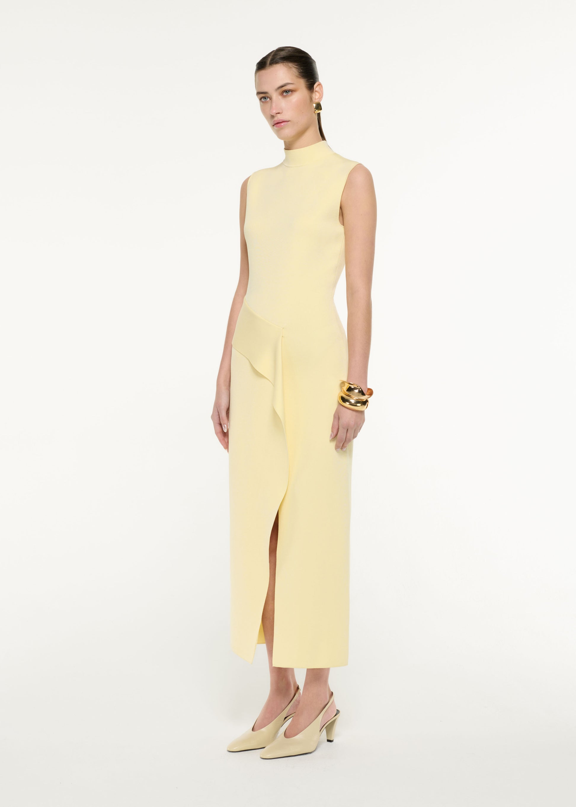 Front view of a model wearing the Flat Knit Drape Midi Dress in Yellow