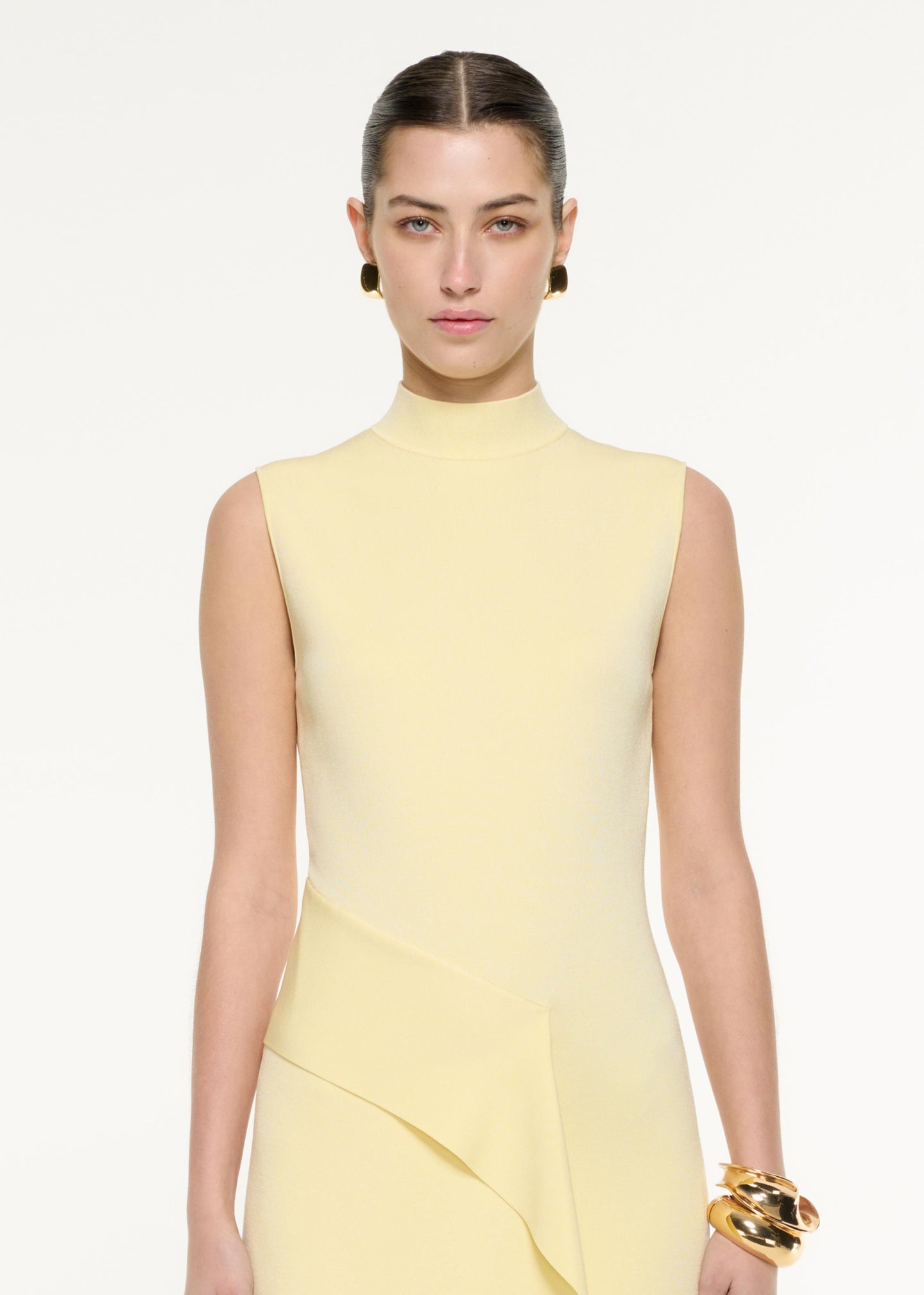 Close up of a model wearing the Flat Knit Drape Midi Dress in Yellow