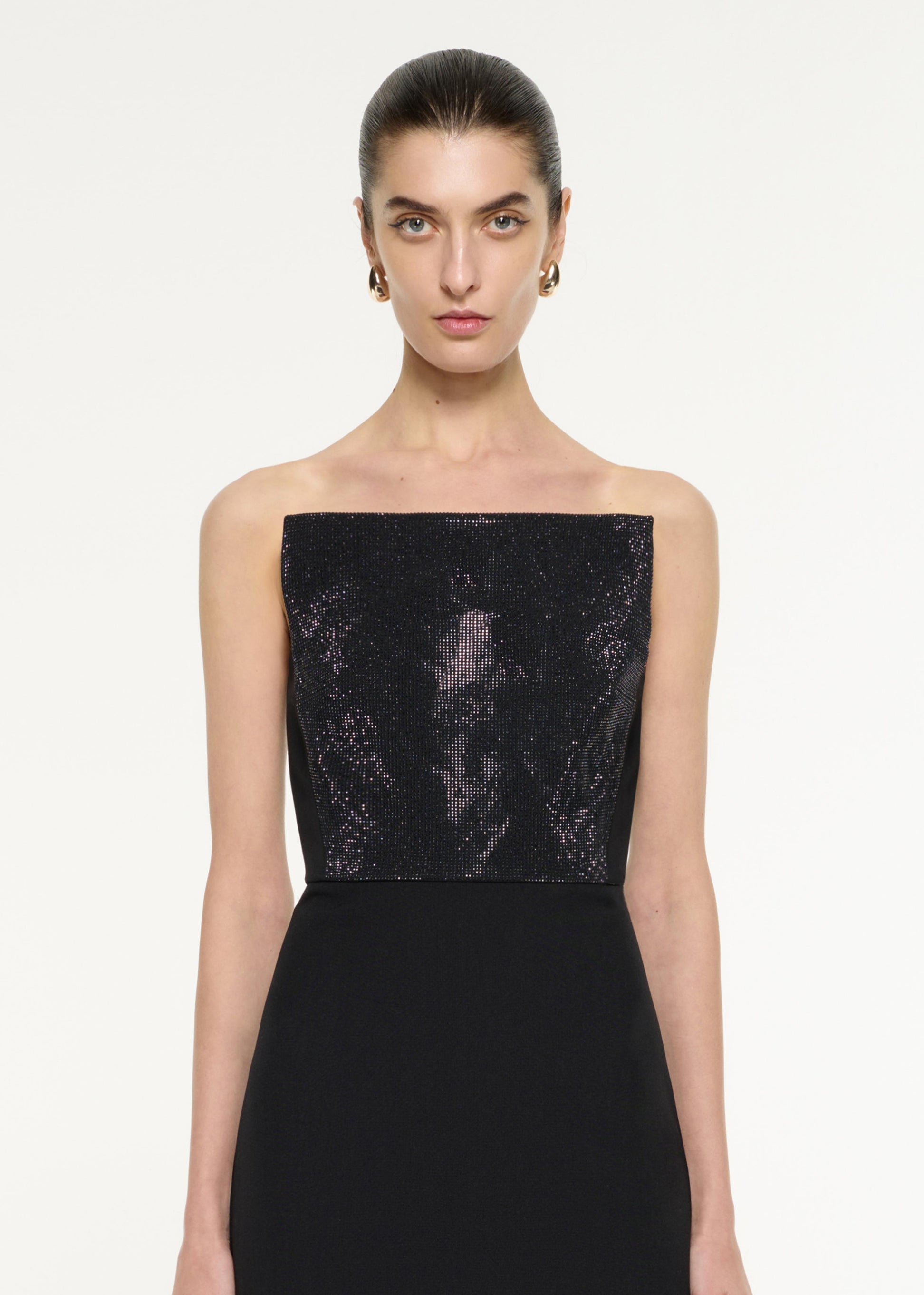 Close up of a model wearing the Diamante Panel Gown in Black