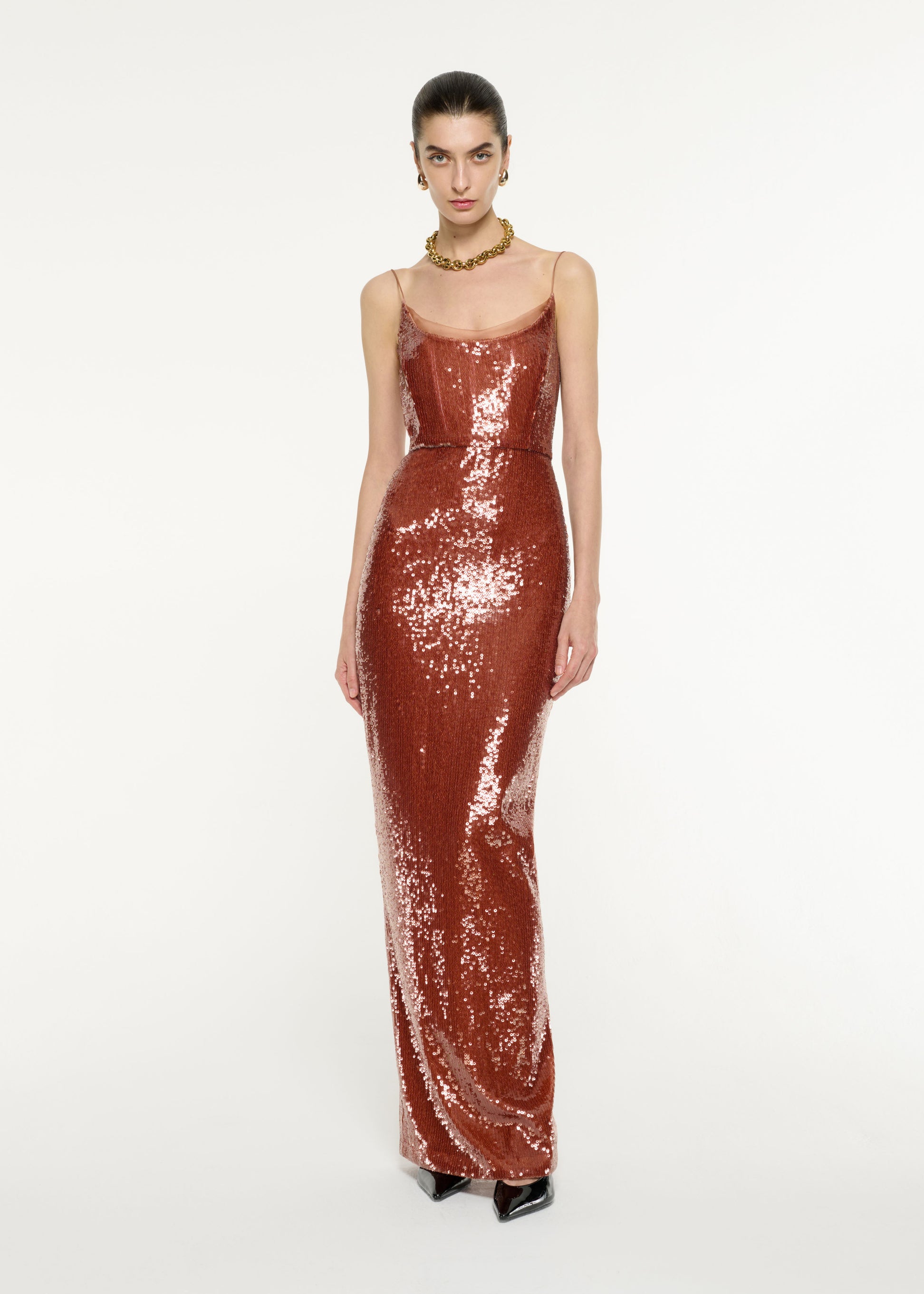 Front view of a model wearing the Sequin Gown in Copper