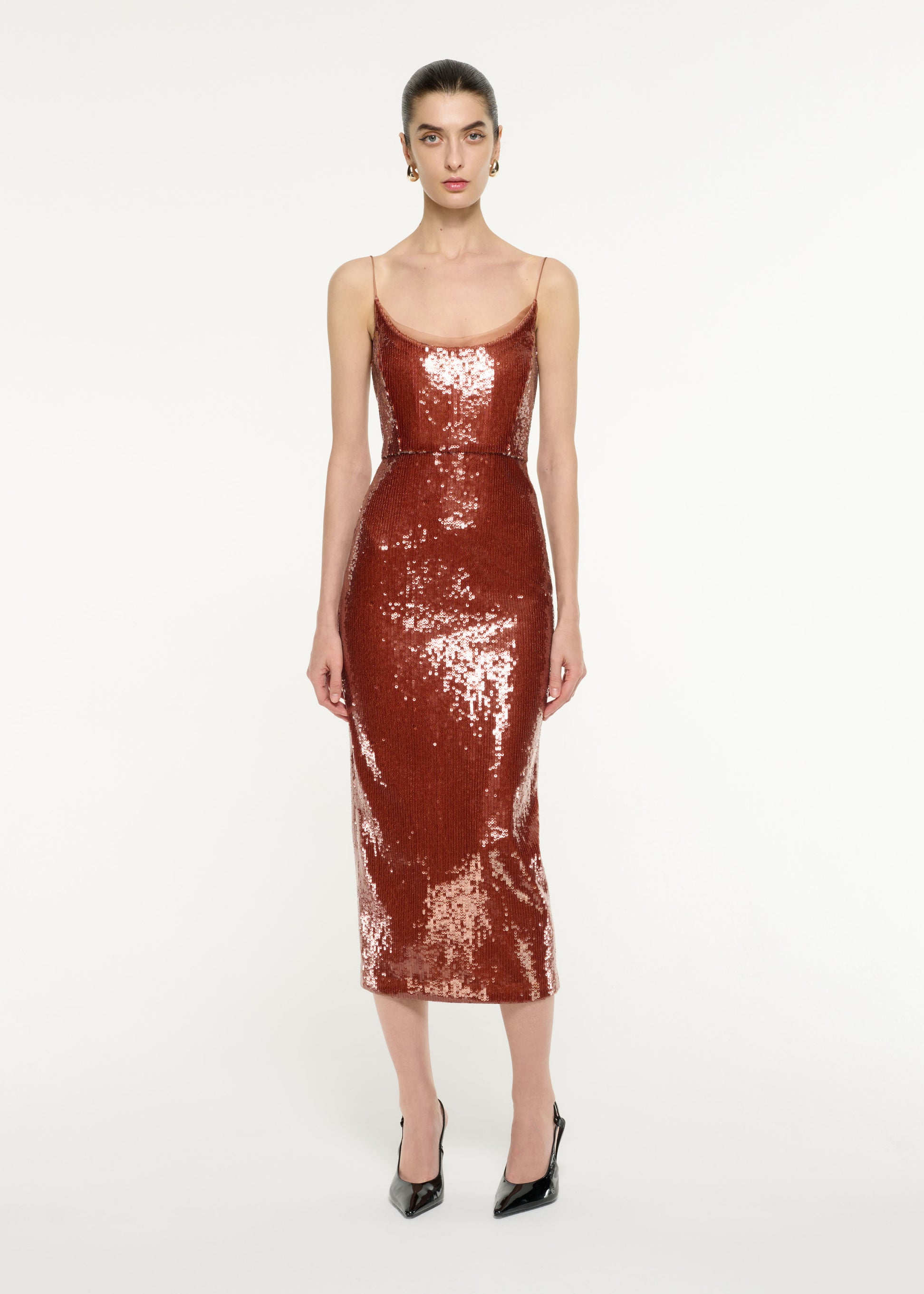 Front view of a model wearing the Sequin Midi Dress in Copper