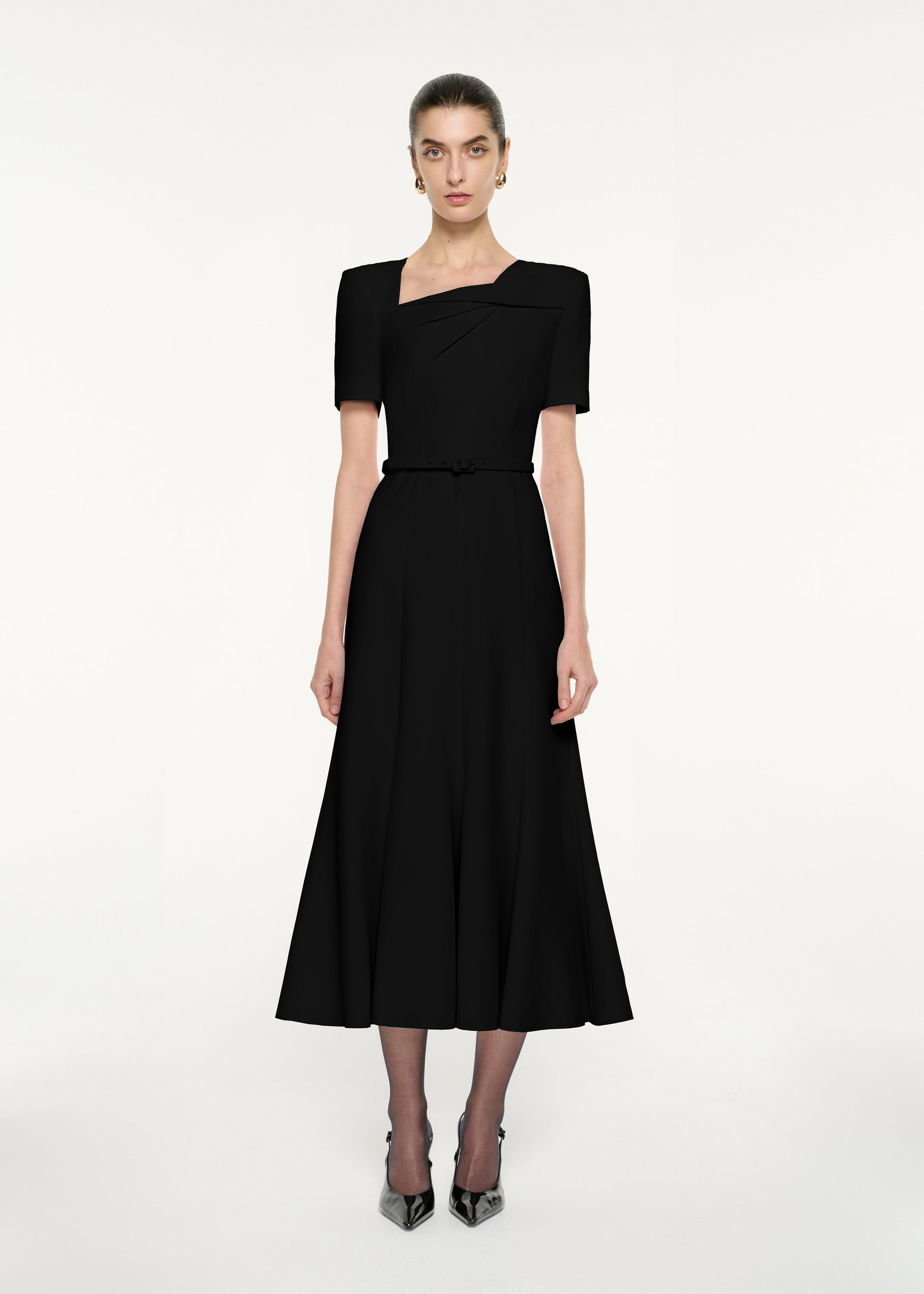 Front view of a model wearing the Short Sleeve Twist Drape Midi Dress in Black