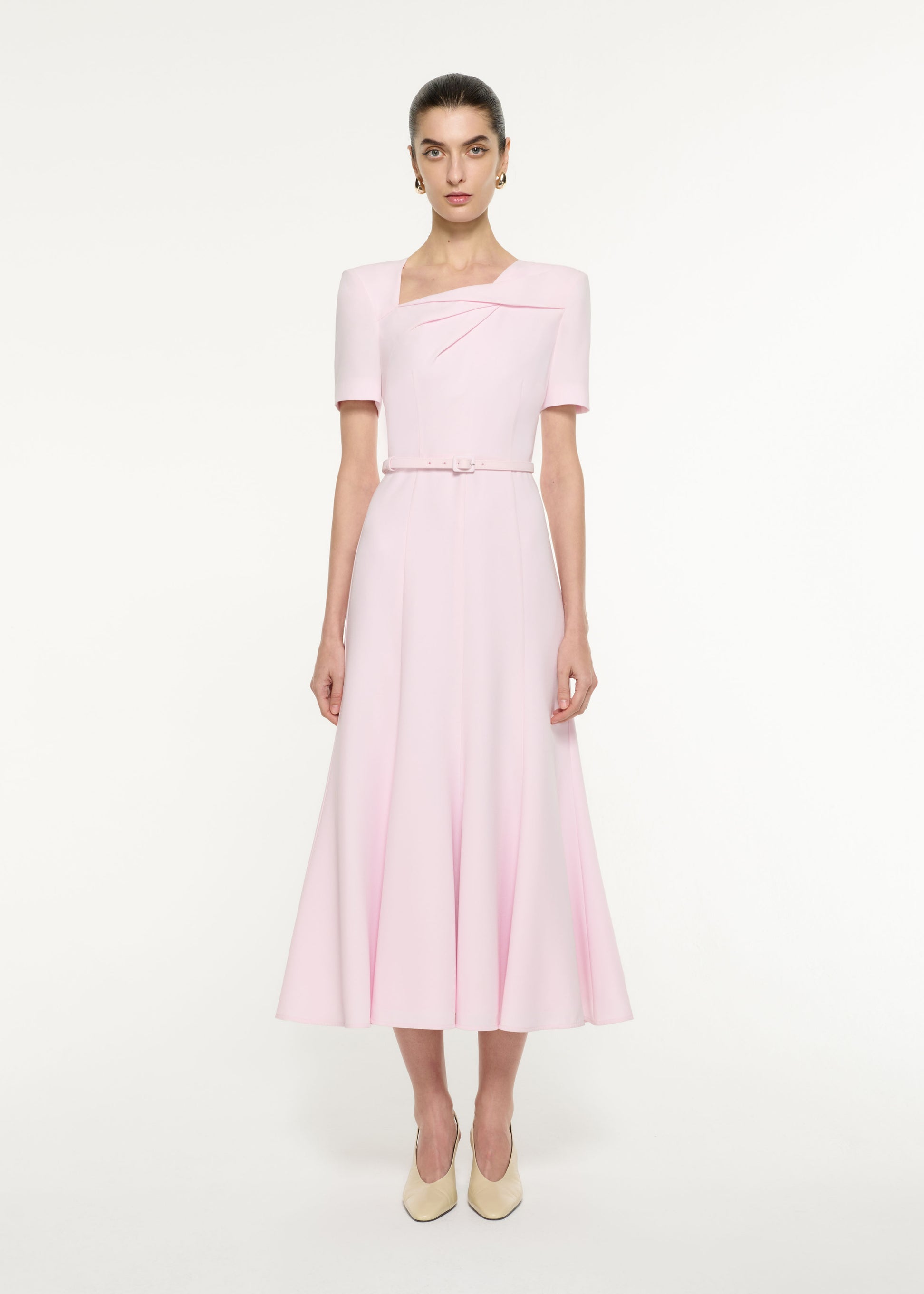 Front view of a model wearing the Tri-fold Drape Midi Dress in Light Pink
