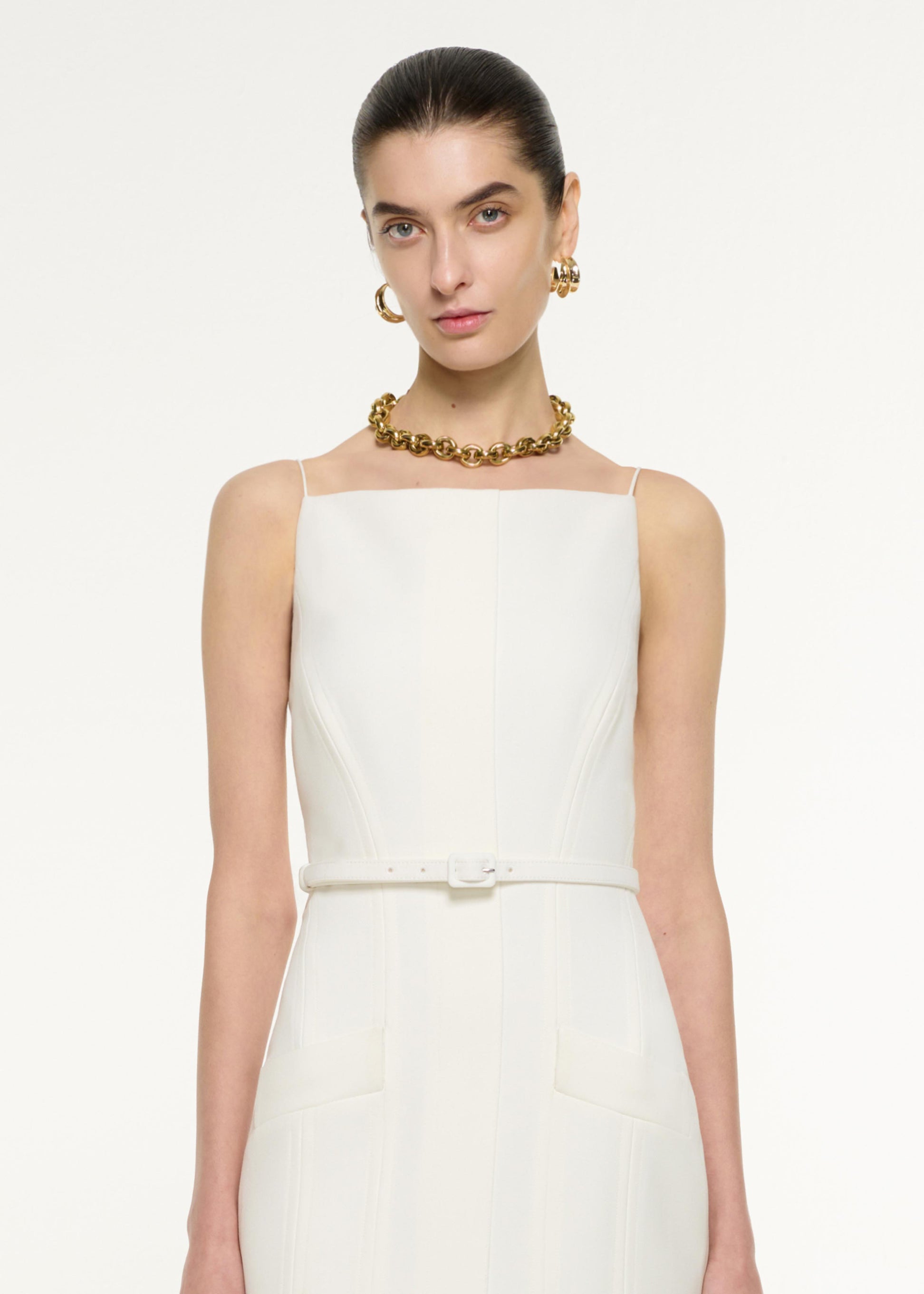 Close up of a model wearing the Crepe Tailored Midi Dress in Cream